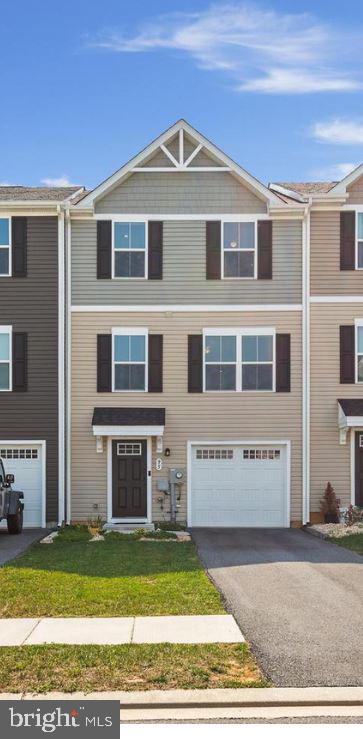FOR IMMEDIATE RENT! Located in the community of The Lakes at Martinsburg. This newly built (2020) townhome features 3 Bedrooms, 2.5 Baths. Perfect commuter location with easy access to Route 9 and I-81. The highlight of this townhome includes an open concept floor plan between the living/kitchen/dining on the main level. In addition to an on-demand hot water system, this property comes with the added advantage of a water softener, a backsplash and pantry in the kitchen, a reading nook located on the walk-in level, and a vinyl fence and patio in the backyard for privacy and entertaining. Smart home features include a Nest Thermostat, front and rear Ring cameras, and a smart garage door opener. The finished rec room could easily be used as a multi-purpose space like an additional small bedroom or office space. Front side access Attached Garage with Long Driveway for parking your cars. Gas community. Washer and dryer in unit. Pets are allowed. Security deposit and first-month rent upfront. Call to schedule your private tour!
