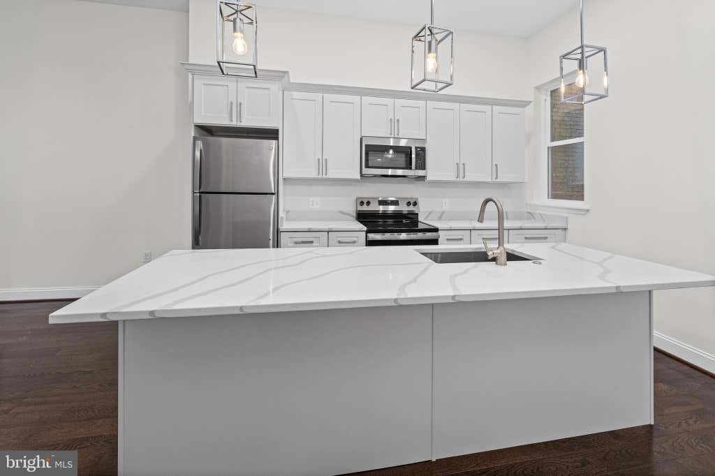 Photo of 530 N Carrollton Avenue, BALTIMORE, MD 21223 (MLS # MDBA2226872)