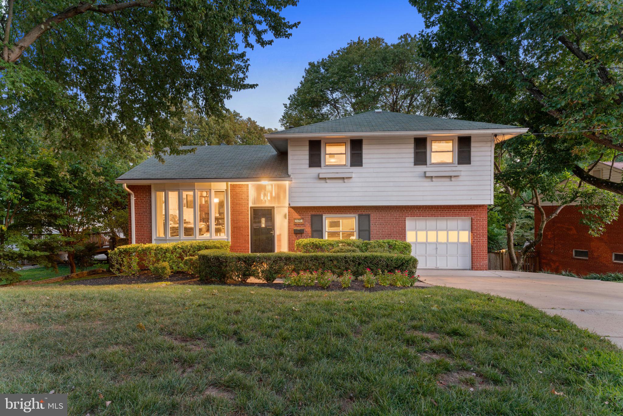 Welcome to this almost 2300 sq ft modern and updated split-level home in Bethesda's coveted Wyngate neighborhood! The luxurious home has 4 spacious levels of beautifully finished space with paneling, crown molding, and recessed lighting throughout. The home is perfect for entertaining and everyday living with an open concept main level of kitchen/dining/living rooms, all with comfortable space and a nice flow. The gourmet kitchen boasts stone countertops, stainless steel appliances, custom cabinetry with ample storage and lots of countertop space, a chef’s dream for prepping and cooking. The dining room fits a full size table and the living space has a beautiful new bay window that brings in so much light. Between that and the floor to ceiling sliding door in the dining space, the main level is so bright and open!
With 4 total bedrooms, 2 full baths, 1 half bath, plus an office/gym space, and another family room this home has all of the rooms anyone would need. The second level has 3 bedrooms and 2 full baths, including a large primary (fits a king size bed) with newly renovated ensuite primary bath. The 2 other bedrooms have ample closets with custom organization systems as well. There are 2 great linen closets in the hall to accommodate all of your storage. The first level down is a spacious family room and flex space with a walkout to the screened in porch. There is a powder room for guests, and garage access to the oversized one car garage. The second level down is still at grade, so it gets great light through large windows. It has a guest room, office/gym space, and nicely done laundry room. There is also a walkout to the backyard which provides great light to the lower level and convenient access to the backyard. There is another bonus space beyond the laundry area that is a super large room - large enough to walk in! You will never run out of storage space!
The home has been impeccably maintained and updated, including a new primary bath in 2018, a completely new HVAC system in 2021, new hot water heater & washer/dryer 2023, new sewer line to the street fully done including WSSC side in 2023.
This home is perfectly situated on a large 8000+ square foot lot, with beautiful mature plants and trees. It really is perfect with privacy trees, a hardscaped lounging area for entertaining, deck for sitting and grilling, screened in porch for dining and multiple play spaces in the yard. The yard even has uplighting and ground lights for plants and trees, it looks magical when the sun goes down, truly an oasis in the heart of Bethesda.
This home is a commuter’s dream, with easy access to bus lines to Downtown Bethesda and the Bethesda Metro, NIH, Walter Reed, and Suburban hospital, 495 Beltway, and buses. You are only a 5 minute drive to Wildwood Shopping Center, multiple groceries, great restaurants and shops. The neighborhood also has many parks and playgrounds, some just steps away like Wyngate woods, Arylawn, and Fernwood to name a few. There’s also highly ranked schools like Wyngate Elementary as well as tennis/pool clubs like Old Georgetown Club just minutes away. The neighborhood has all the amenities and access to Downtown Bethesda and Wildwood you could ask for while still feeling the sense of a quiet and friendly community. Welcome Home!