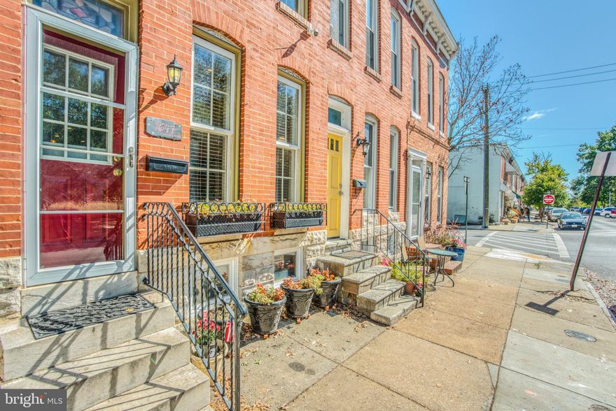 Wonderful Riverside Park Front Rowhome with PARKING! This lovely home features wood floors, open layout, exposed brick, upgraded kitchen with breakfast bar, lots of pantry space, 1/2 bath & washer/dryer on 1st floor, separate dining room area with bench seating leading to rear porch (grill included!), overlooking a rear yard and PARKING PAD! 2nd floor has wood floors, front bedroom with walk-in closet, full bath in hallway, middle bedroom with full bath leading to rear 3rd bedroom with vaulted ceilings, heated floors, and private balcony railing. 3rd floor is full addition that can be a 4th bedroom or recreational room with wet bar, wine & beer fridge, real wood fireplace, skylight to 2nd floor, Skylights, Integrated Sound System & LED Lights throughout home, Dual zone Heat & AC, and state of the art security system, FRONT and REAR DECKS with AMAZING PARK & CITY VIEWS! WATER VIEW from the REAR DECK! Full improved basement with hatch entry, wide staircase, cellar freezer Make this your NEW HOME NOW! Start enjoying the CITY LIFE!