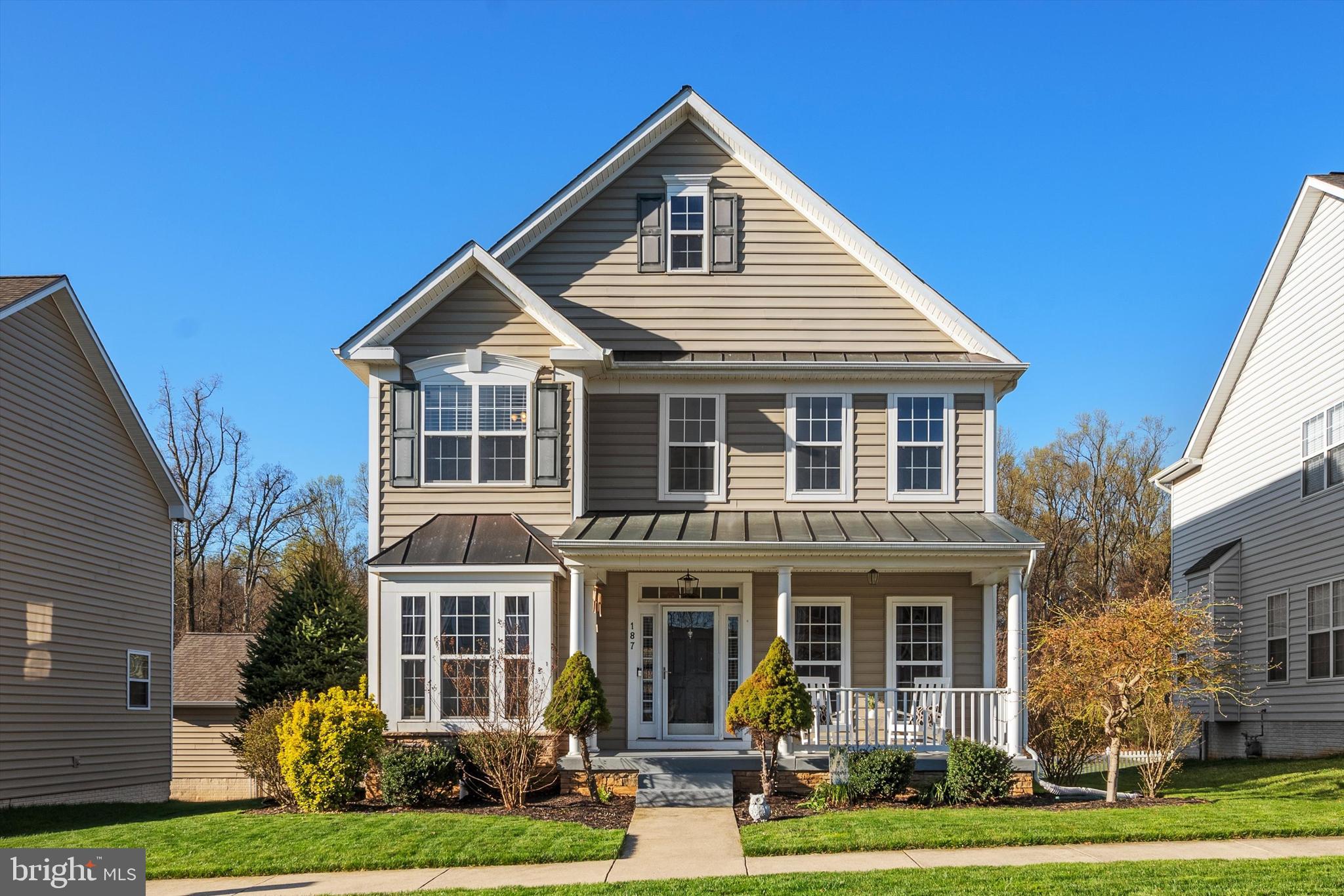 Impeccably maintained Colonial boasting tons of curb appeal and backing to trees in Charles Town's desirable Huntfield community! This home's inviting front porch and private back deck provide ample outdoor space to enjoy the beautiful spring weather. Inside, you’ll find a lovely, eat-in kitchen with tons of cabinets, gas range, high-end countertops and backsplash, a new fridge, a convenient island, and spacious pantry. The adjacent dining room (brand new furniture conveys!) and family room create a floor plan with great flow and function. There’s also an office space/additional sitting room on the first floor. Updated and tasteful light fixtures, new wood blinds, neutral paint colors, and a gas fireplace with shiplap detailing elevate this home’s appeal. The lower level is fully finished and features a built-in dry bar with ceiling-height subway tile backsplash, rec room with waterproof LVP flooring, full bath, egress window, and separate space that’s ideal for guests or a private office. Upstairs are 3 spacious bedrooms, 2 more full baths, and an attractive and functional laundry room. Plenty of storage is available throughout the home and in the detached 2-car garage. Plus, the home has been converted from propane heat to 2 electric heat pumps for added cost savings and efficiency. The Huntfield community has so much to offer, including tennis courts, 2 playgrounds, walking paths, and close proximity to schools, local amenities, and major commuter routes to Virginia, Maryland and Washington D.C. Don’t miss the chance to make this beautiful and conveniently located property your new home!