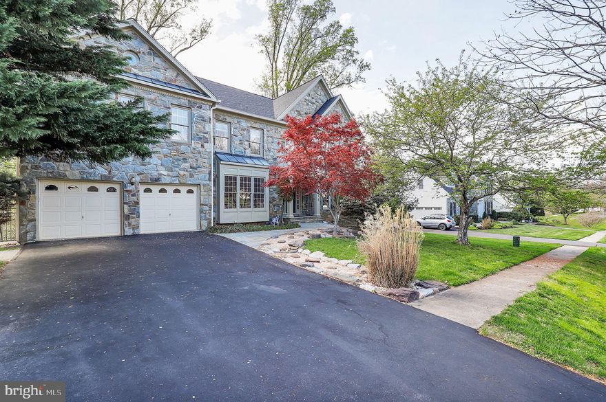 This charming and spacious 5 Bedroom, 4.5 Bath Stone front Colonial blends classic style with modern functionality in a highly convenient location. A beautiful Japanese Maple adds curb appeal and a warm welcome in the front yard. 

Inside, you’ll find a sunlit living room with crown molding and a cozy wood-burning fireplace, creating the perfect atmosphere for relaxing or entertaining. The kitchen features a central island, ample counter space, and a bright breakfast nook ideal for morning coffee. Upstairs, a generously sized primary suite, with vaulted ceiling, offers a private retreat, while the basement adds incredible flexibility with a second kitchen, bedroom, and full bath—ideal for guests, multi-generational living, or additional entertaining space.

Enjoy outdoor living on the large deck overlooking a fenced backyard, with steps leading to a private patio. Host crab feasts with friends and family—JC Crab House is just around the corner. Conveniently located near shopping, dining, and grocery stores, with quick access to Route 200 for easy commutes to I-95 and I-270.