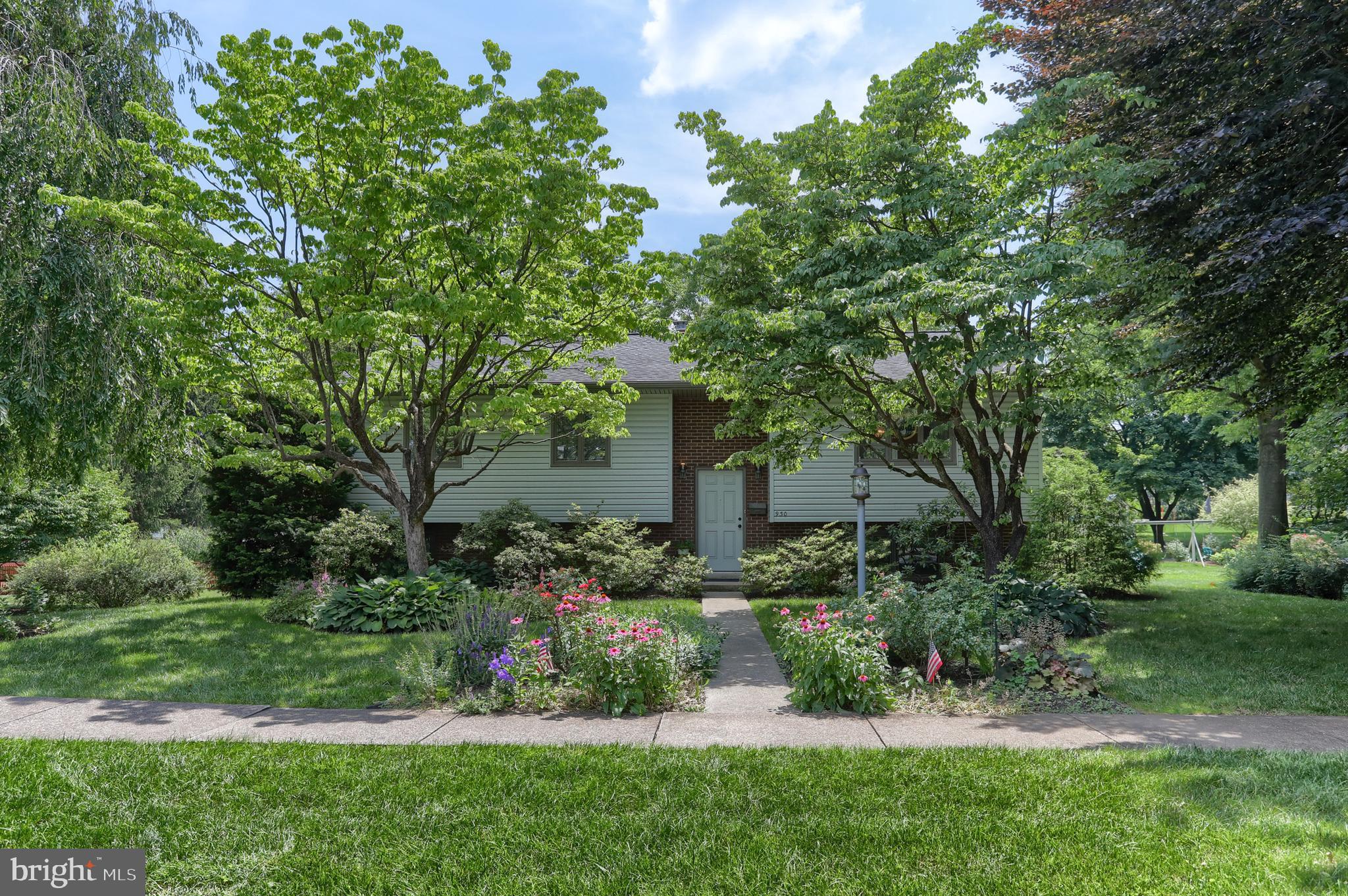Hershey - This home in nestled among mature landscaping on a .38 acre lot in Briardale.  It has been well maintained over the years.  Located on a quiet tree lined street within walking distance to the Hershey Medical Center and a few steps from the popular walking/bike path.  This bi-level in unique since it features an additional sun room  boasting 3 sides of windows and skylights for an abundance of natural light.  There is a large 4th bedroom below the sunroom with full size windows as well.  Hardwood flooring is featured in the formal living room, dining room  and hallway. The  kitchen features a breakfast bar.  The main level also has a large primary bedroom/bath suite, 2 additional bedrooms and bath.   The expanded  lower level features a sitting area, family room with cozy gas fireplace, powder room/laundry room and the  4th bedroom that is above grade.  The one car garage is oversized with plenty of storage.  Enjoy the included hot tub overlooking the large flat back yard.   Location, location - this one has it.  Close to Rt.322, 422, and  minutes to downtown Hershey.