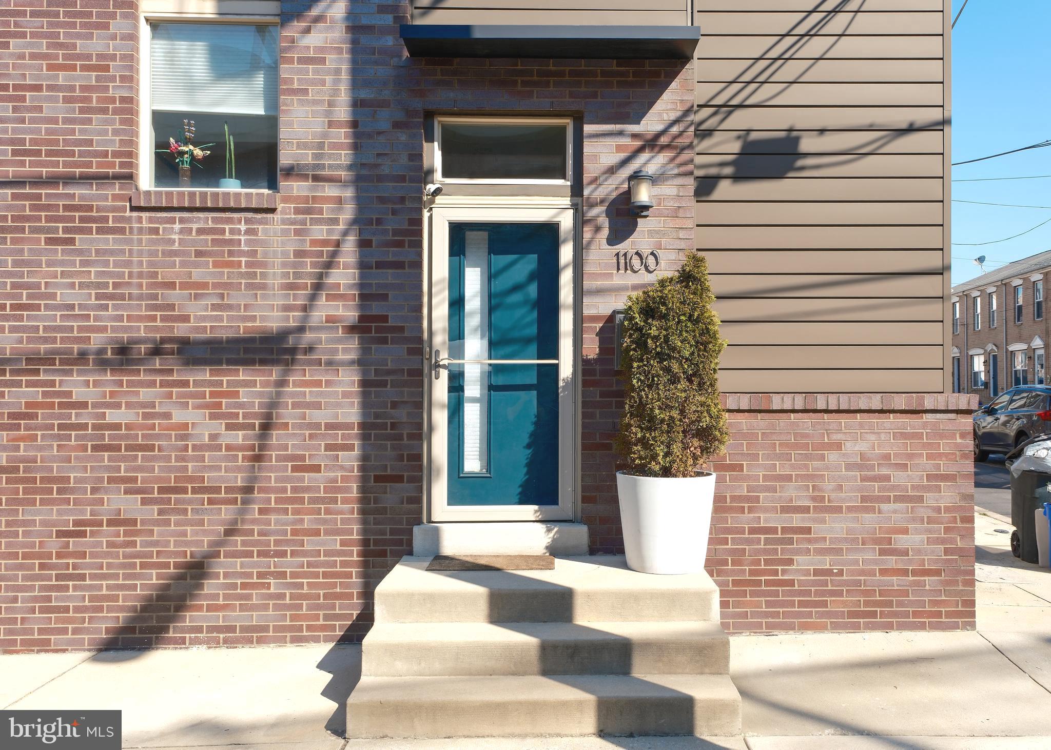 Gorgeous, brick 3-story end-row townhouse in Fishtown with gated 2-car parking, a private roof deck, fully finished basement, and tax abatement. Conveniently located on a quiet street within walking distance of Frankford Ave and the heart of Fishtown, yet it’s only a minute’s drive to I-95. Since it’s a corner property, three sides of the home feature an abundance of windows, including a window-lit stairwell that stretches three levels. These additional windows help fill the home with natural light on all four levels. The kitchen features custom cabinetry, stainless steel appliances, mosaic tile backsplash, and white, quartz countertops. Natural hardwood flooring extends throughout the home. The finished basement provides a generous amount of additional living space complete with ceramic tile floors, recessed lighting, a large half bath, and plenty of closet storage space. The second floor has two guest bedrooms at either end of the hallway, and a centrally located full bathroom with floating vanity. The master suite, on the third floor, leads to an oversized master bathroom with double vanity sink and large tiled shower with dual shower heads. All bedrooms have their own ceiling fan, ample closet space, and upgraded custom solid wood doors. The final flight of stairs leads to the newly resurfaced roof deck (10-year warranty), which provides 360 degree views, including the Center City skyline. In addition, the home has Nest thermostats, an August smart lock, and wired security cameras covering the exterior of the property and parking spaces- all of which allow for remote operation and additional security.
Guests can enjoy a recently constructed nearby free parking lot, or the short walk to access the Delaware River Trail Network- providing safe accommodations for walkers, joggers, or bicyclists. Don’t miss this amazing opportunity!