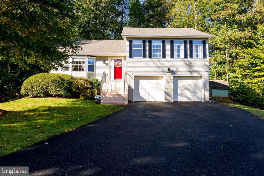 Brick walkway welcomes all to this very comfortable home that is nestled into a private lot. Pride of ownership is reflected by the new roof, new gutters,updated kitchen w/granite,stainless steel appliances, hardwood plank flooring, traditional lighting,updated baths,& custom paint.Living space is extended into backyard by a wonderful deck,shed, fenced yard,& over-sizedgarage! 15 min to Quantico