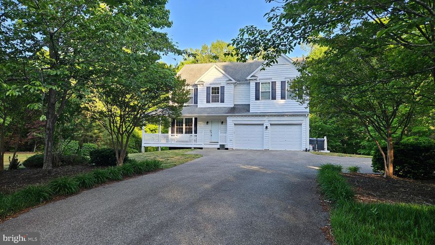 Prime opportunity to obtain a home in which to grow.  The room sizes are generous and the basement has been laid out to be finished into a XL recreation room, bedroom and full bath (rough-in).  The primary suite is expansive and features 2 walk-in closets, a large bathroom with dual vanities, soaking tub, separate shower and a picture window framing the lush, green back yard.  The kitchen features Kraftmaid cabinets and an open concept with a large table space surrounded by windows and walk-in pantry.  The kitchen is open to the family room which has a gas fireplace and custom book shelves.  There are hardwood floors, plentiful, high quality windows, a 2 car garage and an abundance of outdoor spaces ( covered front porch and 2 rear decks).  The lot could not be nicer!  It allows for a full walk-out basement with large windows and French doors.  There is a wooded view from the front and the rear which creates serene views and maximum privacy.  The community amenities include a basketball court, playground/tot lot, baseball field, and tennis courts (projected to be upgraded with pickleball courts).
