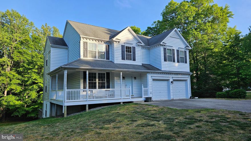 Prime opportunity to obtain a home in which to grow.  The room sizes are generous and the basement has been laid out to be finished into a XL recreation room, bedroom and full bath (rough-in).  The primary suite is expansive and features 2 walk-in closets, a large bathroom with dual vanities, soaking tub, separate shower and a picture window framing the lush, green back yard.  The kitchen features and open concept with a large table space surrounded by windows and walk-in pantry.  The kitchen is open to the family room which has a gas fireplace and custom book shelves.  There are hardwood floors, plentiful, high quality windows, a 2 car garage and an abundance of outdoor spaces ( covered front porch and 2 rear decks).  The lot could not be nicer!  It allows for a full walk-out basement with large windows and French doors.  There is a wooded view from the front and the rear which creates serene views and maximum privacy.