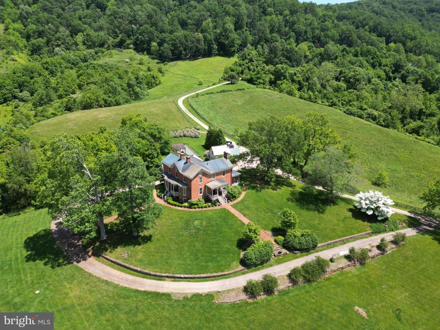 Historic Inn for sale in Sperryville, Virginia

Unique Opportunity
Experience the serenity and breathtaking scenic views of rolling foothills and grazing pastures with this exceptional opportunity in Sperryville, Virginia. This residence, with a rich history dating back to the 1820s, has been meticulously preserved for generations. For the past 12 years, the owners have shared this extraordinary home as a popular inn. Now, it is available for sale as either a full-time residence or a continuing inn/bed and breakfast business.

Property Overview
Perched atop a hill, this historic inn offers panoramic views of the Blue Ridge Mountains that fill the skyline as far as the eye can see. The simple rectangular structure was built from bricks fired on the banks of the Thornton River and trees harvested from nearby Turkey Mountain. The beautifully landscaped front yard provides a welcoming approach to this historic gem.

Main House Features
Architectural Charm: The main house boasts original hardwood flooring, high ceilings, and two fireplaces, maintaining its historic charm.
Living Spaces: The main level houses a large living room and two bedrooms, each with ensuite baths.
Upper Level: Upstairs, you’ll find three more bedrooms, each featuring ensuite baths and breathtaking mountain views. The rooms are beautifully decorated with furniture and artwork collected by several generations.
Natural Light: Ample windows and high ceilings create a light and open atmosphere throughout the home.
Dining and Kitchen: Below the main level, a spacious formal dining room can accommodate more than 14 guests. The large kitchen has been updated with modern amenities, including a stainless steel refrigerator, granite countertops, and abundant cabinet space.
Innkeeper’s Quarters: Adjacent to the kitchen and dining area, the innkeeper’s quarters consist of a large bedroom, a bathroom, and office space.
Modern Amenities: High-speed internet and a Tesla charger (subject to verification).

Additional Cottage
This listing includes a charming cottage just steps away from the main building, perfect for extended family and friends. A blend of comfort and character, the cottage features a spacious sitting area, a small kitchenette, a full bath, and a bedroom.

Location and Lifestyle
Dining: Close to sought-after culinary experiences, including Three Blacksmiths and the Inn at Little Washington.
Proximity to Attractions: Conveniently located approximately three miles from the Thornton Gap entrance to Shenandoah National Park and ten miles to Old Rag Mountain. 
Local Charm: Enjoy the quaint village of Sperryville, known for its serene landscapes and proximity to local wineries and breweries, art galleries, and antique shops.
Outdoor Activities: Ideal for nature lovers, with numerous hiking trails, fishing spots, and outdoor adventures in the surrounding areas.

Whether you’re seeking a full-time residence with historical charm or looking to continue operating a successful inn, this historic property is ready to accommodate your vision. Don't miss out on this rare opportunity to own a piece of history in Rappahannock County. Envision yourself living in this magnificent home and creating a gathering place for family and friends.

Embrace the Charm
Discover the unique blend of historic charm and modern amenities that this beautiful property offers. Schedule your showing today and embrace the opportunity to make this extraordinary inn your new home or business venture.