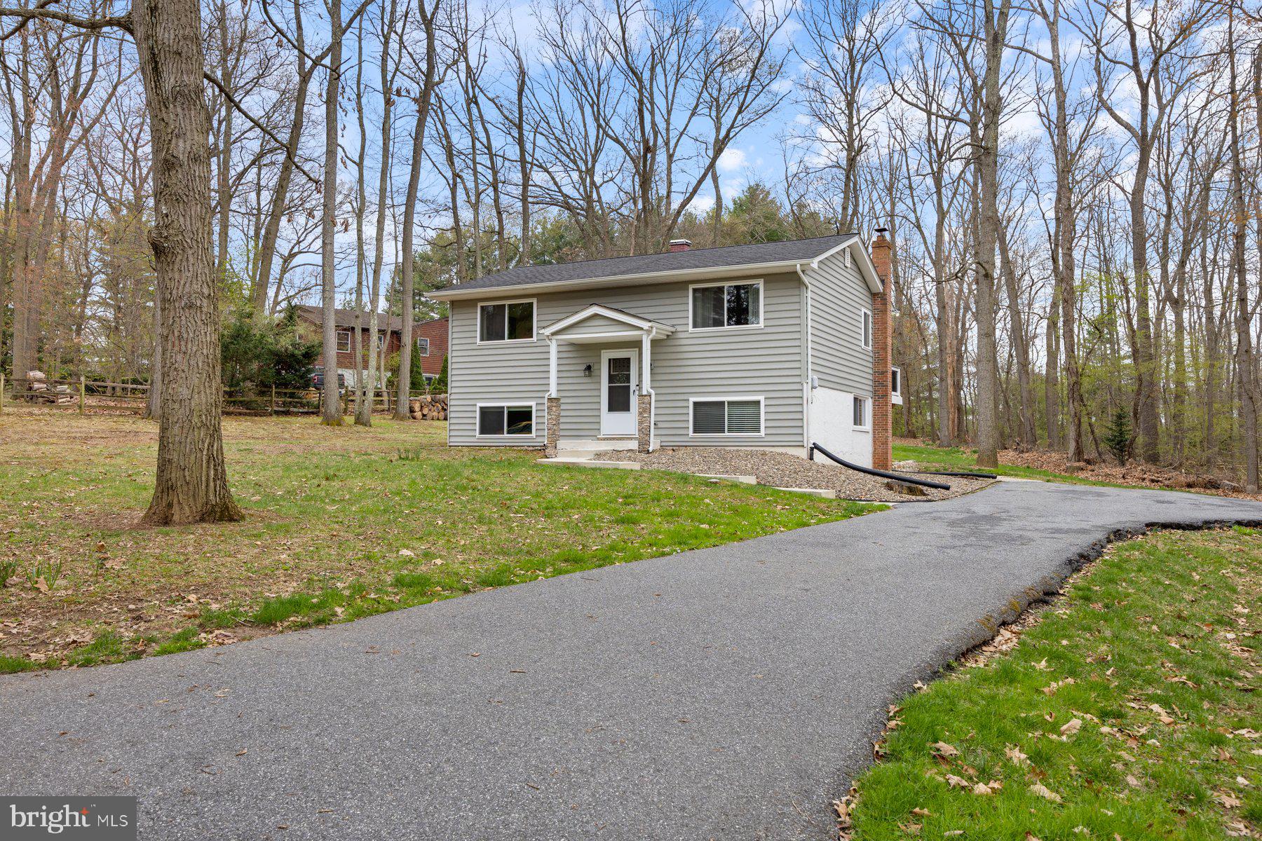 Charming 3 bedroom Split Level with 2 full 1 half bath l on on gorgeous lot. This home shows like a model- Features Gourmet kitchen with granite counters, custom cabinets and SS appliances. Lower level is fully finished with full bath and upgraded flooring with cozy wood stove. Exterior has new deck for all your entertaining and shed with new roof. A must see!!