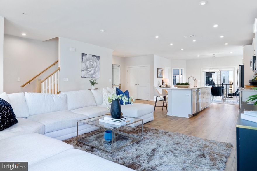 Like new!! Enjoy the Farmers Market right next door! Welcome to a modern luxury home in the heart of Ashburn, adjacent to One Loudoun’s vibrant downtown! Located in the sought-after Ashbrook Place community, this stunning Stanley Martin-built Julianne end unit model offers 2,680 beautifully finished square feet of thoughtfully designed living space. Barely two years old and meticulously maintained, this townhome-style condo combines sophisticated design, quality craftsmanship, and an unbeatable location. Featuring an open-concept layout, this home is filled with natural light and elevated by premium finishes throughout. The gourmet kitchen is a true highlight with stainless steel appliances, a large center island, upgraded cabinetry, and a generous walk-in pantry. The main level also includes a versatile home office—perfect for remote work or study. 
Retreat to the expansive primary suite complete with a spa-inspired en-suite bathroom, double vanities, and a spacious walk-in closet. Additional bedrooms provide comfort and flexibility for family or guests. Enjoy fresh air and peaceful moments on your private balcony, or entertain guests on the spacious roof top terrace—ideal for gatherings, sunsets, or relaxing evenings under the stars.
The one-car garage plus additional driveway parking space add everyday convenience, while the unbeatable location offers the walkability of One Loudoun’s premier shopping, dining, and entertainment—without the burden of high condo fees, which are only $275/month!