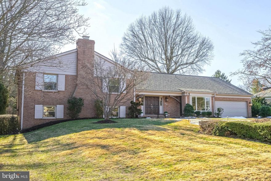 Nestled on a picturesque 0.67-acre cul-de-sac lot in the highly sought-after Evermay community, this expanded all-brick split-level home has been beautifully refreshed, seamlessly blending classic charm and enduring sophistication.  A slate walkway leads to the welcoming front porch, where double doors open into an inviting foyer. Freshly painted throughout, the home offers generous living spaces designed for both refined entertaining and everyday comfort. The grand formal living room, anchored by a stately brick wood-burning fireplace, boasts an oversized picture window with serene views of the expansive rear grounds. Rich parquet-style oak hardwood floors, crown molding, and chair rail detailing extend into the formal dining room, highlighted by a sophisticated new brushed gold chandelier.  The kitchen is a chef’s delight, featuring solid hardwood cabinetry, granite countertops, a travertine backsplash, and premium stainless-steel appliances, including Viking and KitchenAid. A peninsula with breakfast bar seating overlooks the freshly painted family room, a warm and inviting space with a vaulted, beamed ceiling, a striking brick accent wall with a wood-burning fireplace, and a picturesque window.  The breakfast area blends seamlessly into the engaging space. A light-filled sunroom, with floor-to-ceiling windows, three sliding glass doors, and a soaring wood cathedral ceiling, offers a versatile retreat—ideal as a second family room, home office, or serene lounge surrounded by nature. A stylish powder room and a functional laundry/mudroom complete the main level.  Ascending just half a flight of stairs, the upper level showcases gleaming hardwood floors. The primary suite is a private sanctuary with two walk-in closets and recessed lighting. The newly renovated en-suite bath is beautifully appointed with a dark double cherry vanity, granite countertops, marble-style tile, and frameless glass shower door. Two additional spacious bedrooms, including one with a walk-in closet, share a hall bath with a double vanity and a shower/tub combo.  The lower-level recreation room continues the home's rich parquet-style hardwood flooring and is anchored by a third brick wood-burning fireplace. Two additional bedrooms, one of which is ideal as a home office, share a well-appointed full bath with a new gray vanity and brushed nickel fixtures.  Outside, a slate patio overlooks the expansive, level backyard—an ideal setting for outdoor gatherings, play, or quiet relaxation.  Perfectly positioned just moments from the world-class shopping, fine dining, and entertainment of Tysons Corner, this exceptional residence also offers effortless access to major commuter routes, including Georgetown Pike, George Washington Parkway, I-495, I-66, and the Dulles Toll Road. The Silver Line Metro and Washington, D.C. are just minutes away. Nature lovers will appreciate the proximity to a 150-acre wooded preserve with scenic hiking trails, as well as Clemyjontri Park, a renowned playground just three minutes away. Franklin Sherman Elementary, Longfellow Middle, and McLean High School. Newer Roof. Newer Windows. Newer Tankless Hot Water Heater.