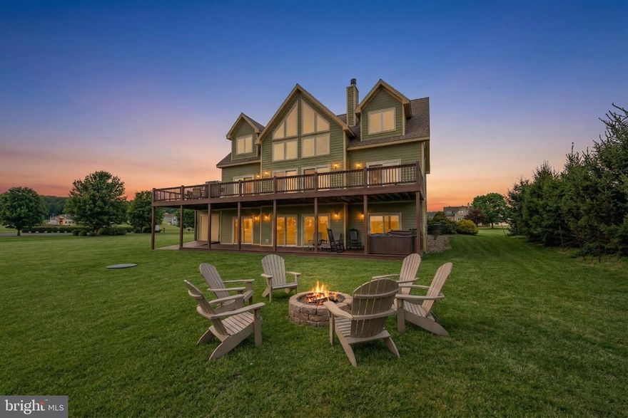 Welcome to Field of Gold, a stunning home in the sought-after Waterfront Greens community, offering the perfect blend of luxury, comfort, and entertainment. With 6 spacious bedrooms—4 featuring private ensuites—this home provides ample space for both relaxation and gathering with friends. Designed with entertaining in mind, the expansive kitchen flows seamlessly into the dining and living areas, creating a warm and inviting atmosphere. The lower-level family room with a wet bar is ideal for casual evenings, while the upper-level lofted game room offers the perfect spot for a game of pool. Step outside to enjoy the home’s generous outdoor living spaces, including a sprawling deck and patio—perfect for hosting or unwinding in nature. Cozy up by one of two fireplaces during cooler months, or gather around the outdoor firepit under the stars. Located in the popular Waterfront Greens community, you’ll have access to an array of amenities including tennis courts, mini golf, and a par-3 golf course, along with lake access areas for kayaking and swimming. Whether you're looking for a full-time residence, vacation getaway, or investment opportunity, Field of Gold is a remarkable Deep Creek Lake retreat ready to be yours.