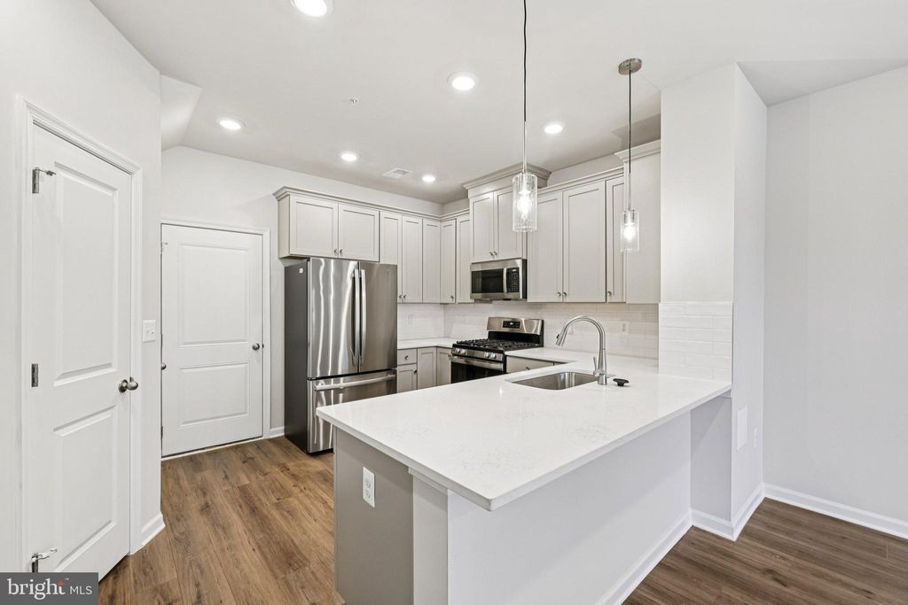 Photo of 19566 Village Walk Drive, MONTGOMERY VILLAGE, MD 20886 (MLS # MDMC2222176)