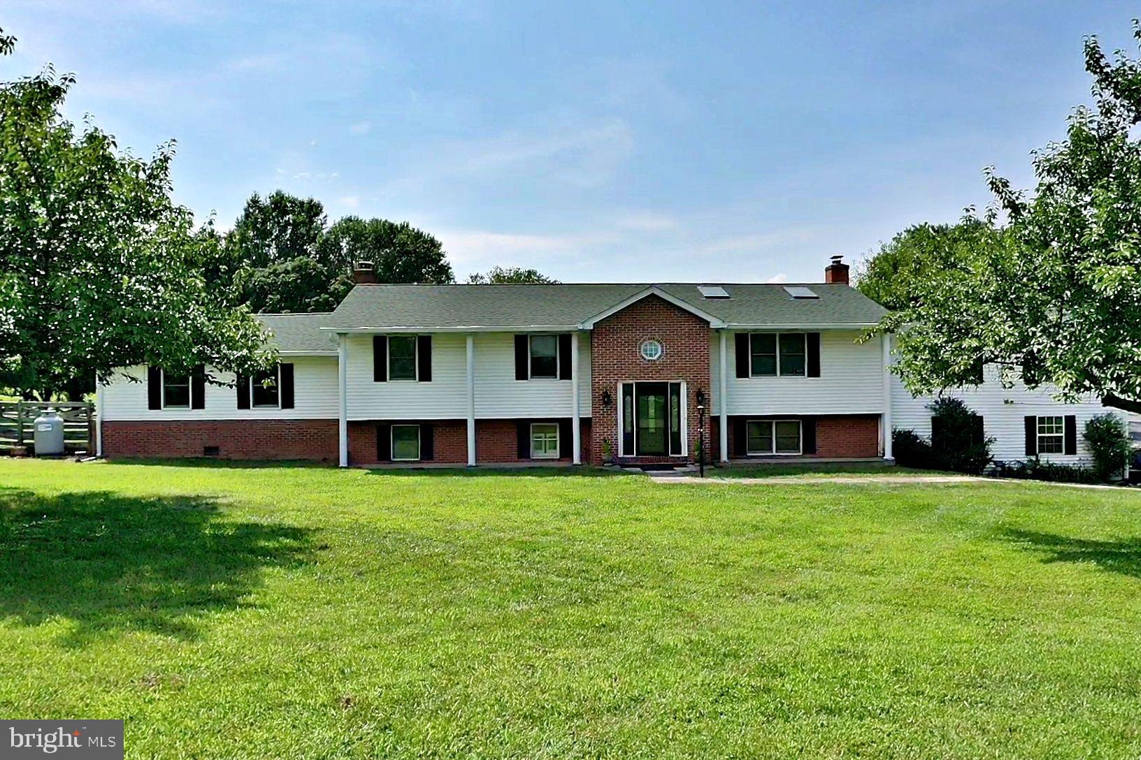 Spacious Split foyer custom built home with over 3000 sq ft and situated on two acres with two car garage and inground pool. Property features three bedrooms (septic), four bathrooms, three additional rooms could be used as bedrooms (6 in total), two primary bedrooms with full baths, three fireplaces (two gas and one woodburning), molding upgrades, multiple built in shelving/bookcases, tile flooring, upper level laundry room and lower-level laundry room with steam shower, Living room with vaulted ceiling, gas fireplace, and skylights with built in blinds. Kitchen has 42 in cabinets, ample extra cabinetry space, SS appliances, and more. Foyer has custom hardwood flooring, exposed beams, and built in area. Primary bedroom has gas fireplace, custom built in bookcase, cedar lined closets and a jet tub. Multiple decking and above garage there is a workshop. The Primary bedroom, garage, and the workshop all have mini split units as well. Located near the Sam Michaels Park and close to all MD VA commuter corridors.