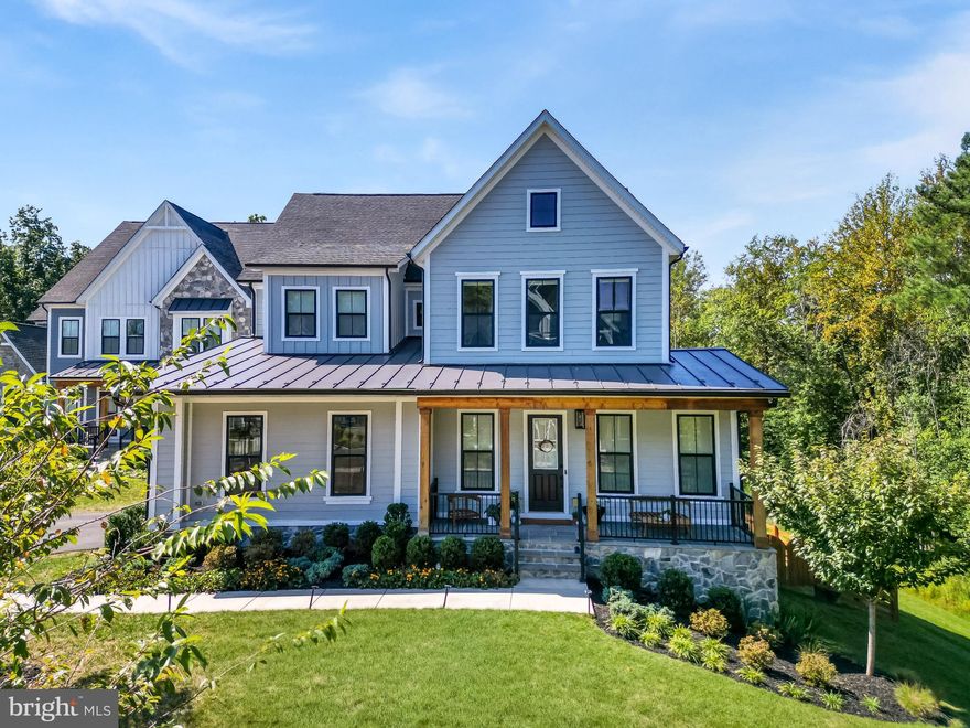 Stunning Modern Farmhouse with Designer Finishes & $200K+ in Upgrades! This like-new Grandin III model by Van Metre, built in 2022, sits on a quiet cul-de-sac in the sought-after Hartland community. With 4 bedrooms, 3.5 bathrooms, a 2-car side-load garage, and nearly 4,500 finished square feet, this home combines warmth, sophistication, and functionality on a premium 1/3-acre lot surrounded by mature trees.

The main level welcomes you with 10-foot ceilings, European white oak LVP floors, and abundant natural light. The chef’s kitchen features a quartz waterfall island, quartz countertop and backsplash, professional-grade range hood, stainless steel appliances, a 5-burner gas cooktop, built-in microwave and double wall ovens. The maple latte colored center island with cabinets on both sides adds extra storage, while the spacious walk-in pantry and mudroom provide exceptional convenience. A screened-in porch with stairs leading to a large stone patio makes this home perfect for indoor/outdoor entertaining.

Upstairs, the primary suite offers LVP flooring, a walk-in closet, and a spa-like bathroom with a maple latte double vanity accented by gold fixtures, a freestanding soaking tub, and a frameless glass shower. Two bedrooms share a hall bath with double vanity, while the fourth bedroom enjoys a private en-suite bath and walk-in closet. A laundry room with LG washer and dryer and soaring 9-foot ceilings complete the upper level.

The walk-out basement offers a bright, finished recreation room and rough-in plumbing with an egress window, creating potential for an additional bedroom and bathroom. An extra 700 square feet of unfinished space provides ample storage or room for future expansion.

Additional highlights include two HVAC systems, an EV charger in the garage, a security system, a fenced backyard, and a beautifully landscaped lot with a 600SF stone patio with seating wall and wooded views. Hardiplank siding, architectural shingles, and stone exterior offers low maintenance and durability for many years.

Living in Hartland means access to resort-style amenities including a fitness center, pool, trails, tennis and basketball courts, parks, and even a local winery. Surrounded by rolling hills and scenic woodlands, this is truly a one-of-a-kind home offering the perfect blend of modern luxury and natural beauty.