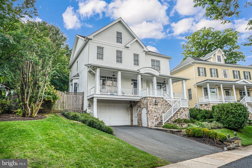 Discover the epitome of Arlington living in this stunning 6-bedroom, 5.5-bath home, offering over 4,100 square feet above grade and more than 5,200 square feet of finished space. Nestled in the highly sought-after Little Falls Court, this residence sits proudly on a commanding 12,815-square-foot lot, providing breathtaking views from the expansive, covered front porch.

Designed for both daily living and effortless entertaining, the home features a private backyard that backs to Knights of Columbus. The main level includes an office, formal living and dining rooms, a powder room, and a fully equipped eat-in kitchen that seamlessly flows into the family room, complete with a cozy fireplace.

The upper level boasts three spacious secondary bedrooms, one with an en-suite bath and two sharing a Jack and Jill bath. The generous owner’s suite includes two custom walk-in closets and a large bathroom, primed for your personal touch. The loft adds extra flexibility, offering another bedroom, a bonus room, and a full bath.

On the entry level, you’ll find a front-loading, oversized two-car garage, a theater room with a full wet bar, an additional bedroom, and a full bath. The private, terraced backyard features a large flagstone patio and mature landscaping, creating a peaceful oasis.

Located in the prestigious North Arlington area, this rare opportunity falls within the Discovery Elementary, Escuela Key Immersion, Williamsburg Middle, and Yorktown High School pyramid. Don’t miss your chance to experience this exceptional home!