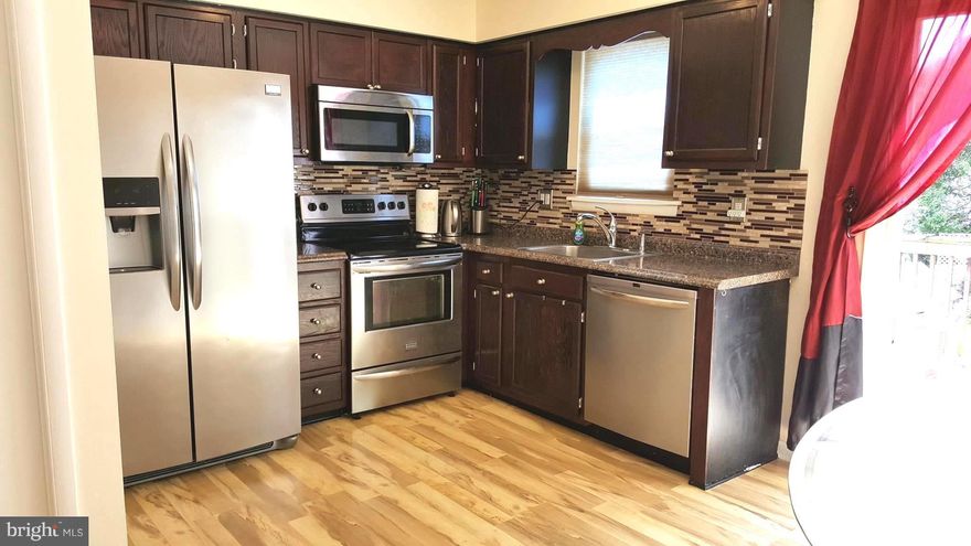 Upgraded/updated 2 bedroom 1 full & 2 half bath townhouse. Few years: SS appliances, kitchen cabinets, , bathrooms, laminate & carpet floor. Roomy country kitchen with slider to deck. Basement with full walkout to fenced backyard. No HOA. Convenient to I-795, restaurants, shopping.