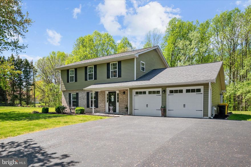 Lovely Colonial in the sought-after Bay Country community, offering space, updates, and a peaceful setting surrounded by nature. Set back on just over an acre with a long private driveway, this home delivers both privacy and functionality. The upper level features a spacious primary suite complete with a walk-in closet, oversized vanity with ample counter space, and an ensuite bath. Three additional generously sized bedrooms, a full hall bathroom, and a linen closet complete the second floor.
On the main level, you’ll find a thoughtfully designed layout ideal for everyday living and entertaining. The inviting family room showcases built-in shelving and cabinetry, a dedicated space for TV mounting, and updated flooring. A versatile bonus room—perfect for a home office or flex space—adds to the home’s functionality. The kitchen offers a large pantry and flows seamlessly into the dining area, where sliding glass doors lead to the outdoor patio—perfect for gatherings and enjoying the peaceful setting. A convenient half bath and a laundry/mud room with direct access to the two-car garage complete the main level. The exterior features a brick paver patio, a large shed for additional storage, and expansive yard space with endless possibilities. Recent updates include: New Carpet being installed right now, HVAC (2016); windows, gutters, siding, and sliding glass door (2018); garage doors, shed roof, flooring in foyer, half bath, and family room, garage entry door, ceiling fans with lights in all four bedrooms, and custom built-ins (2019); updated half bath (2020); updated primary bath, oven, and dishwasher (2021). The roof has been replaced within the last five years. Bonus opportunity: Architectural plans approved by the health department for a 22x60 addition/in-law suite and an 18x34 garage are available. The property has also been perked for a new septic system by previous owners. Bay Country is known for its picturesque, tree-lined streets that create a natural canopy—perfect for morning walks, evening bike rides, and enjoying the beauty of the outdoors right in your own neighborhood. If you’ve been looking for space, updates, and a setting that feels like home the moment you arrive, this is the one. Schedule your private tour today!