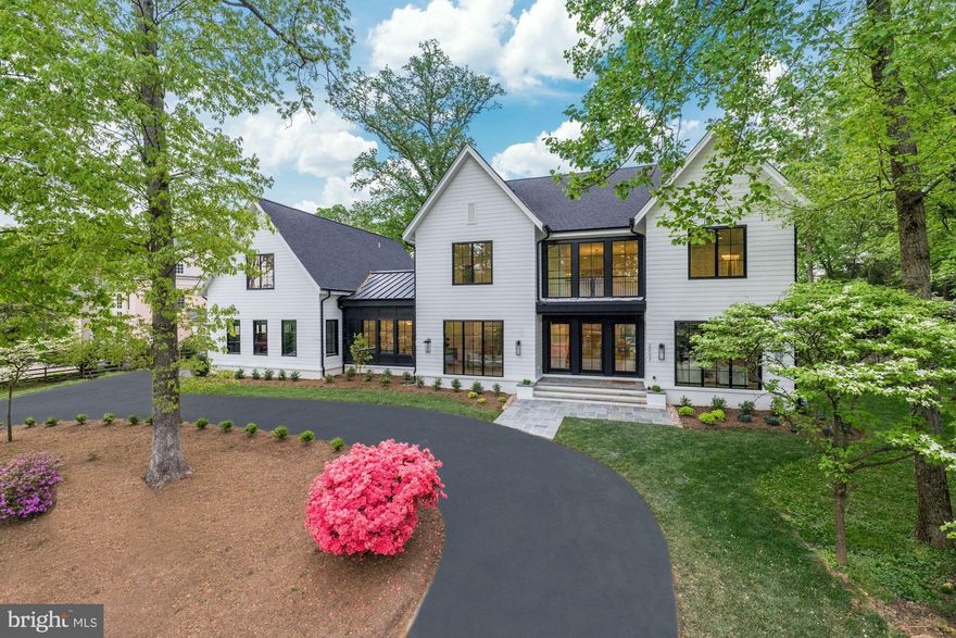 Inspiration lives well at 2007 Rockingham Street, newest offering in Franklin Park, McLean. This amazing new construction home has come to life from the combined vision of top industry-leading specialists, premier builder, award-winning architect, and interior design.  This transitional design offers unprecedented standards while offering the pinnacle of close-in McLean living. Truly seamless indoor-outdoor entertaining and more all come together with unmatched modern styling and the sense that anything is possible… and always right within reach The house encompasses 6 bedrooms - each with private ensuite bathrooms - in a floorplan which covers 8209 SF+/- of interior space and 4,700 SF+/- of exterior, with ample room for a future pool and also a shaft for future elevator.  Situated on nearly .5 acres+/- of flat property and designed to offer its future residents a wonderful lifestyle like no other, the home takes the indoor/outdoor living to the next level due to the floor to ceiling windows and multiple sets of sliding doors which allow an abundance of natural light to fill the home from nearly every room. Numerous outdoor porches and patios are staged over a series of levels and locations to create countless opportunities to enjoy the outdoors.  Anchored by an impressive entry with a massive white oak staircase and featuring large custom glass and metal doors with a dramatic foyer allowing light from above to flow down, the main level's plan and design maximizes the use of traditional molding and transitional yet timeless finishes. The main living space features a library or living room, formal dining room with butler’s pantry, a gracious family room with a beautiful gas fireplace with soapstone surround, a gourmet kitchen, a powder room and a hall (perhaps for future pool) full bath.  The art of cuisine and exquisite taste finds its home in a gallery-quality kitchen with flawless presentation and premium appliances. An inviting openness between the kitchen, dining, and living areas allows life to flow easily from one moment to the next.   The first level hyphen features a room that defines flexible space. The many options for use are a work-from-home office, a bedroom, an entertainment/recreation room, a virtual school room, or it is perfectly located as a pool room should a pool be installed. The hyphen is outfitted with built-in cabinetry, a full bath, doors to the rear yard and another patio and also serves as the connection to the mudroom, guest suite and garages.    More than a bedroom, the Primary Suite serves as a retreat within the retreat – where vistas and serenity can be enjoyed without compromise. The primary retreat features sliding glass doors opening to a large private terrace overlooking the rear yard. Thoughtfully designed to ensure privacy and serenity, the oversized closet is dually connect to the luxuriant bath and the bedroom. The luxuriant wet room spa bath is complete with a free-standing soaking tub, large shower, a water closet, and dual vanities.   Chic and comfortable, practical yet poetic, the study brings an additional sense of privacy to a corner of the home, while still granting the inspiration of the world outside just steps away.  In quiet repose or engaged in social enjoyment, 2007 Rockingham provides the ideal setting for whatever captures the imagination. Sited beautifully in the sought-after community of Franklin Park, known for its lush natural landscape, mature trees, and charming rolling hills, this home offers access to the best of McLean with its close proximity to all that Downtown McLean has to offer, and is also ideally situated just minutes to the George Washington Parkway, 1-66, Tyson’s Corner, and the Capitol Beltway.