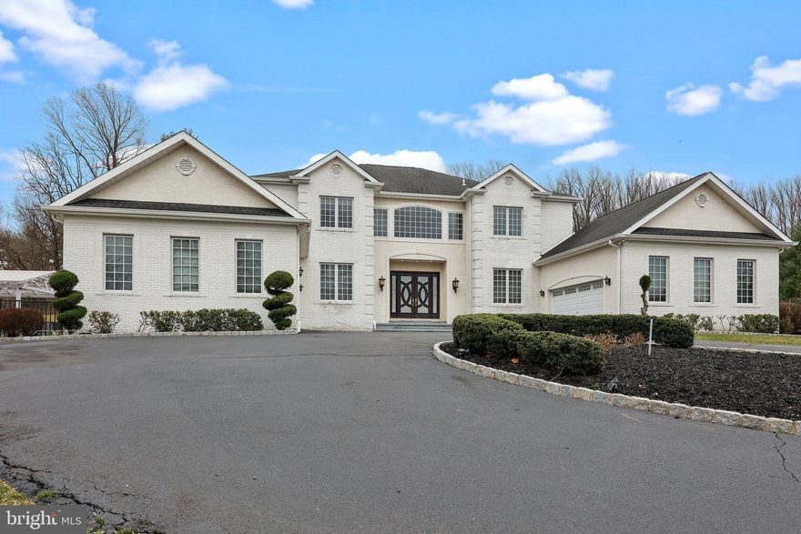 Discover the epitome of luxury living nestled within a private enclave of distinguished properties, harmoniously adjacent to the Pennypack Nature Preserve. Encompassing over 3 acres of lush landscape, this exceptional residence offers an idyllic retreat from the bustling world, without sacrificing convenience.

Upon arrival, be greeted by grand double doors adorned with beveled glass, leading into a breathtaking two-story foyer boasting a limestone floor and a graceful double staircase. Throughout the home, indulge in the finest craftsmanship showcased by extensive crown moldings, custom millwork, and exquisite details such as solid pine doors, gleaming hardwood floors, and striking marble, stone, and granite accents.

Entertain with ease in generously proportioned rooms featuring lofty 10-foot ceilings on the main level, complemented by a state-of-the-art whole house stereo system. Delight guests in the banquet-sized dining room, complete with cherry cabinetry, a fireplace with a fossil limestone surround, and ample space for formal gatherings.

The heart of the home lies in the sunlit great room, boasting a soaring 20-foot ceiling and a magnificent stone fireplace, creating an ideal setting for showcasing art or unwinding with loved ones. Culinary enthusiasts will relish in the designer kitchen, adorned with natural stone floors, Signature custom cabinetry, and high-end stainless steel appliances, including a full 6-burner gas range and double wall oven and walk-in pantry.

Discover an additional haven within this remarkable residence - a primary suite designed to accommodate multi-generational living or guests in unparalleled comfort. Enhanced with hardwood floors and granting direct access to the patio, this space offers unparalleled convenience and privacy. Your personal retreat includes a fully equipped kitchenette with a sink, microwave, and refrigerator, ensuring effortless hospitality. Adjacent, indulge in the attached ensuite featuring a double vanity sink, indulgent Jacuzzi tub, water closet, and dual walk-in closets, providing ample storage and luxurious convenience. With this exquisite addition, this residence seamlessly caters to diverse lifestyle needs while maintaining an ambiance of opulence and tranquility.

Retreat to the luxurious main bedroom suite on the second floor, featuring a cozy gas fireplace, private deck, mini-bar, and two custom walk-in closets. Pamper yourself in the opulent granite bath, complete with a whirlpool tub and oversized steam shower, offering a sanctuary of relaxation.

Designed for ultimate enjoyment, the finished lower level offers approximately 4000 sq. ft. of flexible living space, including a home theater with surround sound, sauna, gym, and bedroom/office, ensuring every desire is catered to. Outside, revel in the secluded summer oasis, featuring a lighted spa, L-shaped pool with lap and diving areas, and expansive patio with outdoor kitchen with built-in fireplace and grill with pergola, perfect for al fresco entertaining.

Complete with attached garage space for four cars and extensive driveway parking, this distinguished residence embodies refined living at its finest, promising a lifestyle of unparalleled luxury and serenity. Welcome home to your private sanctuary amidst nature's embrace.