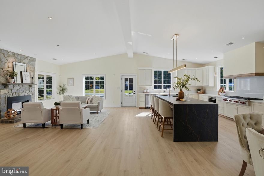 Located on a quiet, tree-lined corner lot in one of Northern Virginia’s most sought-after neighborhoods, this custom-designed modern masterpiece in Vienna offers nearly 5,000 square feet of meticulously finished living space. More than a simple renovation, the property represents a complete top-to-bottom transformation specifically crafted to balance sophisticated entertaining with cozy, functional family living. The heart of the home is a bright, open culinary sanctuary featuring vaulted ceilings and a chef’s kitchen equipped with professional-grade Wolf and Sub-Zero appliances, a massive 10-foot double-waterfall island, dual dishwashers, and custom cabinetry.
The layout is uniquely designed to accommodate both guests and growing families, boasting two large family rooms on a single level—each with its own wood-burning fireplace—alongside five bedrooms and 3 full baths and two powder rooms. The lower level powder room is ready for your choice of finish vanity, toilet and fixtures; rest is complete. Entertainment options extend to the finished lower level, which houses a spacious recreation room and a state-of-the-art movie theater. Additionally, a versatile finished flex room with a separate entry is located above the oversized detached two-car garage, providing an ideal space for a private office or a getaway for children. Every detail focuses on comfort, from the wide-plank light oak flooring to the brand-new radiant heating throughout the first level. Outside, the home features a massive 40’ x 8’ covered front porch and sits within walking distance of downtown Vienna and local schools, offering a premier blend of luxury and convenience. The prelim tour is still available in "Virtual Tour" section as well. We will reopen for showings on Sunday, March 15th.   Please reserved your time now, as the house will be 100%.