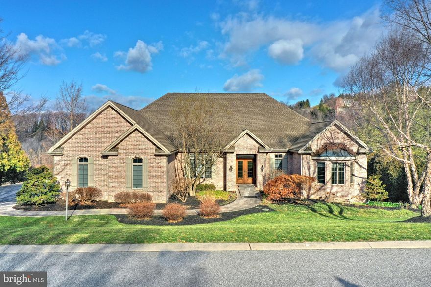 Due to Governor Tom Wolf s mandate regarding COVID-19, we are currently unable to allow any in-person showings of our listed properties.  Contact your agent for more information.  Casual Elegance describes this Distinctive custom built home by Poole Builders well known for their innovative and sophisticated designs. This stunning 4 bedroom 3 full bath 2 half bath home offers todays life style of open, spacious first floor living  with attention to design and craftsmanship.  As you enter the home you will enjoy  Brazilian cherry  hardwood flooring , a formal dining area that is open to the great room featuring custom builts ins, a stone fireplace, coffered ceilings, walls of windows . The restyled and renov  ated chefs kitchen offers custom cabinetry, large center island , quartz countertops and top of the line appliances, from 2 drawer dishwashers, built in drawer microwave, amazing oven range and so much more. There is wet bar area, also part of the kitchen entertaining area, along with  lovely window seat built in the kitchen area so you can  enjoy the walls of windows and gorgeous views. From the great room and kitchen area you can step out onto the oversized trex deck to continue enjoying the privacy and serene setting this home offers. The first floor master suite with hardwood floors, stunning windows, walk-in closets with custom built-ins  open to the updated gorgeous  master bath with custom cabinetry, tile floors, oversized walk in shower and soaking tub. There is an additional bedroom on the main floor with its own en suite bath that was also updated with tile flooring, a custom vanity and walk-in shower. The main level also features an additional powder room that has been updated and a first floor laundry. The lower level of the home, that is a walk out lower level, features a wonderful great room with a large stone fireplace, two additional bedrooms and full bath, an additional powder room, office/ exercise room  and lots of storage areas. The lower level has a covered patio area that you can sit out and enjoy the views on a rainy day.  This truly is an exceptional home from the construction, the meticulous care of the home to the stunning design  throughout the home. The location is perfect for access to amenities, hospitals, schools, parks and so much more.