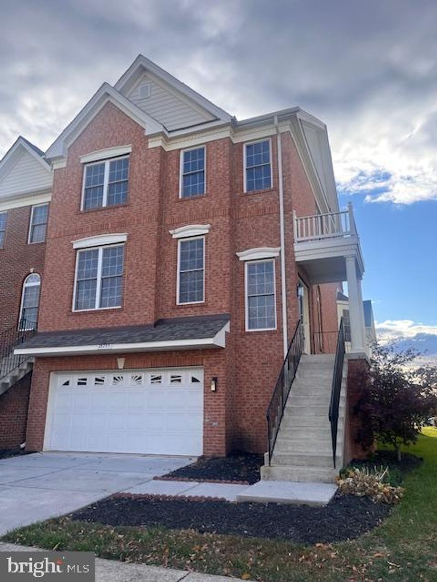 Welcome to your new home in pristine condition.  Located in desirable South Riding subdivision, it is freshly repainted throughout, with all carpets having been professionally cleaned.   The property is an end unit with lots of windows allowing for bright light filled rooms.  The lower-level office may be used as a guest room since there is a full closet and shower room in the large adjacent open spaced family room.   An oversized two car garage, with additional space on the driveway, allows for parking of a total of four cars.  On the main level, the open plan living room and dining room combination makes it so easy for entertaining and gives convenient access to the spacious kitchen and family room at the back of the  main floor.  The kitchen cabinets have all been repainted, and all appliances are in good working order.  On the upper level, the primary bedroom and sitting area are combined to offer an extremely spacious yet private quiet retreat, and the primary bathroom is fitted with new lighting fixtures.  It is such a convenience to have laundry facilities located on this upper level, so no need to trek down any stairs to get your washing done.   You have to visit this home to fully appreciate all it has to offer.  Come and make this your next home - you will be surprised, but never disappointed.