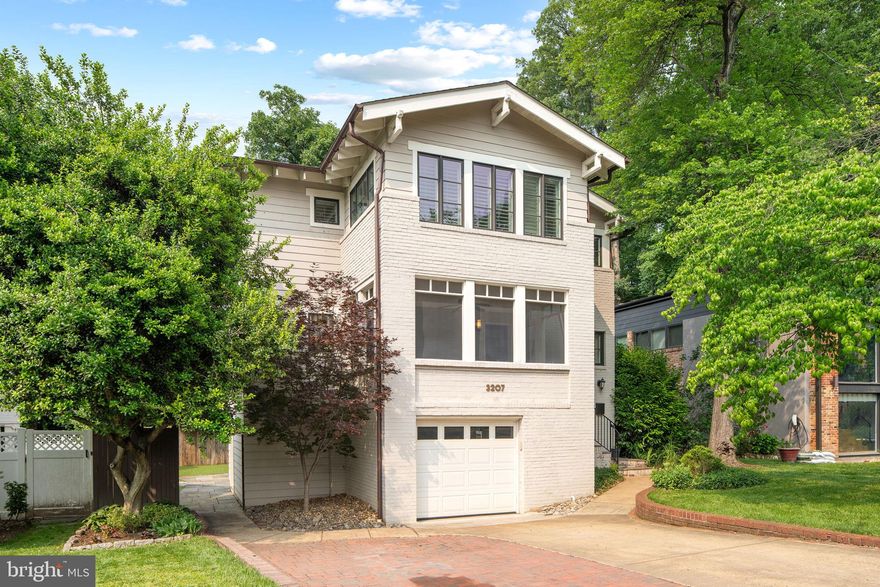 Welcome to 3207 19th Street N—a stunning, completely rebuilt single-family home offering over 3,450 square feet of refined interior living space, plus an additional 350 square feet of screened-in porch and patio. Perfectly positioned in Lyon Village, one of Arlington’s most sought-after neighborhoods, this home offers the rare combination of modern design, walkable urban convenience, and peaceful suburban charm. Rebuilt from the ground up in 2014, this five-bedroom, three-and-a-half-bath residence is nestled on a quiet, tree-lined street with mature landscaping and a generous lot. Just a few blocks from the vibrant heart of Clarendon, you’re within walking distance to boutique shopping, top-rated restaurants, Whole Foods, coffee shops, fitness studios, parks, and more. With only one traffic light to DC, commuters will love the effortless access to Route 29, I-66, and the GW Parkway—plus the Clarendon Metro station is just minutes away, putting the entire DMV at your fingertips.

Inside, the home welcomes you with a light-filled, open-concept layout and gleaming hardwood floors throughout. The formal living room, anchored by a cozy gas fireplace, flows seamlessly into a spacious dining area perfect for hosting. Just off the dining space, a private home office offers the ideal environment for remote work or study. The gourmet kitchen is a true showstopper—featuring white cabinetry with brushed silver hardware, granite countertops, a new subway tile backsplash, and premium KitchenAid stainless steel appliances, including a gas range and Sharp drawer microwave. A central island provides additional prep space, storage, and a prep sink, while a walk-in pantry adds extra convenience. Adjacent to the kitchen is a casual family room that opens directly to a large private deck—ideal for grilling, entertaining, or relaxing among the surrounding trees.

Step into the screened-in porch, where your mornings begin with coffee and birdsong. This thoughtfully designed outdoor space extends your living area and invites you to enjoy the seasons comfortably. Upstairs, the primary suite is a tranquil retreat, featuring large windows, plantation shutters, and hardwood flooring. The custom walk-in closet leads to a spa-inspired bath with marble countertops, a double vanity, and a frameless glass walk-in shower. Three additional bedrooms upstairs are bright and airy, with ceiling fans, ample closet space, and easy access to a well-appointed hall bath with a linen closet and tub. The upper-level laundry room is conveniently located just outside the primary suite.

The walkout lower level includes a second living area with direct access to the attached garage, a flexible fitness or storage room, and a fifth bedroom suite with a private bath and walk-in closet—ideal for guests, an au pair, or multigenerational living. This suite opens to the flat, fully fenced backyard, complete with low-maintenance turf, an under-deck storage area, and an attached shed. A custom mudroom with built-in storage lockers and a main-level powder room add to the home’s practical, family-friendly layout. Energy-efficient systems, updated finishes, and thoughtful design touches are found throughout.

Enjoy the best of Arlington living in Lyon Village—where friendly neighbors, leafy streets, and local parks create a true sense of community. Whether you’re commuting to DC, catching a flight from Washington National Airport, or enjoying a weekend stroll to Rocky Run Park or the Lyon Village Community House, this home offers the location, layout, and lifestyle you’ve been waiting for.