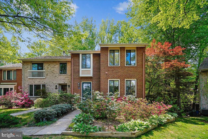 Welcome home to this beautiful, all brick end unit townhouse on a cul-de-sac in the sought after Lake Thoreau community of Walden Cluster. Bring your paddle board, canoe or kayak and enjoy exploring Lake Thoreau from the dock that is mere steps from your front door or jump on the 2.3 mile “Red” trail loop that meanders around the lake, passed Ridge Heights and Lake Thoreau pools, through the golf course and South Lakes Shopping Center. This 4 bedroom, 3.5 bath home has been lovingly updated over the last 30 years. The eat-in kitchen was redesigned with 42” cabinetry, granite counters and backsplash, stainless steel appliances (to include double wall ovens), and updated lighting. A large, freshly stained deck with stairs to the lower level deck sits in nature surrounded by beautiful landscaping. Hardwood floors run through the foyer and dining room, with a step down to the spacious family room. Upstairs you will find the primary suite with an updated ensuite and 2 additional bedrooms that share the updated hall bathroom. The lower level has a built-in workspace, a 2-sided wood burning fireplace, the 4th bedroom, updated bathroom, and a sliding glass door to the rear deck. 
Brand new Architectural Shingle Roof 2025!  Parking spaces are  57 &  64 with tons of guest parking along Ridge Heights. Located only 1.5 miles away from the Wiehle metro and the restaurants at Reston Station, this community has so much to offer right at your doorstep! The Terraset ES/Hughes MS/South Lakes HS pyramid are all within close walking distance. Reston’s 55 miles of trails + the W&OD trail, 15 pools (you can rent these out for private events!), tennis & pickleball courts, 4 lakes, proximity to the countless shops, restaurants, festivals and concerts at the Reston Town Center and Lake Anne’s Saturday morning farmer’s market are just some of the features that make Reston so special. Live, Work & Play Reston!