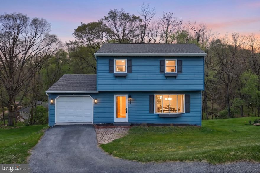 This charming traditional home, built in 1979, offers a perfect blend of comfort and functionality. With thoughtfully designed space, this residence features three inviting bedrooms and one and a half bathrooms, ideal for both relaxation and daily living. The eat-in kitchen is equipped with brand new stainless steel appliances, making meal preparation a delight. The daylight basement provides additional living space, perfect for a family room or home office. Step outside to enjoy the expansive 0.46-acre lot, where a gentle slope leads to a serene stream, surrounded by lush trees and woods. This tranquil setting invites you to unwind on the deck, perfect for morning coffee or evening gatherings. The attached garage offers convenient storage and easy access with additional storage in the back, and the roof was installed in 2023.  The neighborhood is known for its friendly atmosphere and well-maintained surroundings. Nearby schools are highly regarded, ensuring quality education for all ages. With public services readily available, including efficient transportation options, this property combines the best of suburban living with easy access to urban amenities. Experience the warmth and comfort of this delightful home, where every detail has been designed for your enjoyment and peace of mind.