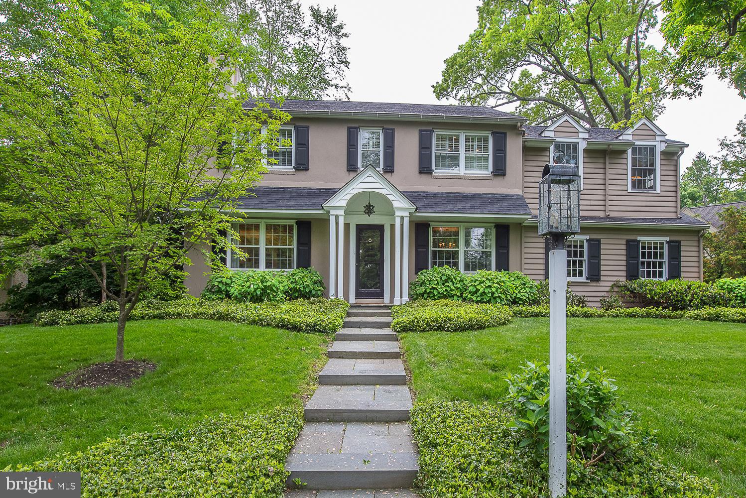 This elegant and immaculate Colonial home is loaded with charm and updated for today's lifestyle. Situated on one of the most sought-after streets in South Wayne and located in top-rated Radnor Schools, this Walk-to-Wayne home has it all, including sidewalks and street lights. Featuring a bright and open floor plan, the gorgeous hardwood floors, custom built-ins, chair rail, crown molding and high-end finishes are sure to please the most discerning buyer. The beautiful and modern kitchen has new cabinetry from Conestoga Valley Custom Cabinets, granite countertops, and top of the line appliances. Step down to the spacious breakfast room with a slider to the beautiful flagstone patio, perfect for entertaining! The connected Family room has vaulted ceilings, large windows and plenty of room for everyone to enjoy. If you want a quieter retreat, the formal living room features a gas fireplace, built-ins and the formal dining room is ready for your next dinner party. Located in the rear of the house is the private first floor office with French doors that lead out to the flagstone patio. The powder room finishes off the first floor. Head upstairs and you will love the new spacious Master Bedroom featuring 10 ceilings, a new Master Bath, with double sinks, large soaking tub and seamless shower, as well as the large walk-in closet with custom cabinets and storage the perfect retreat at the end of the day. The upstairs also features the original master bedroom with an updated en-suite bathroom and two large closets. Finishing off the upstairs are 2 additional bedrooms and an updated hall bath with a double sink vanity. The finished lower level is a bonus with a Playroom, Exercise/Work-out Room, Laundry and a separate unfinished Storage/Utility room. Live on a fabulous street and walk to town, schools and playgrounds. Note: Low Taxes for such a great location! Also minutes away to the Blue Route, train, and the Schuylkill Expressway, the location cannot be beat.