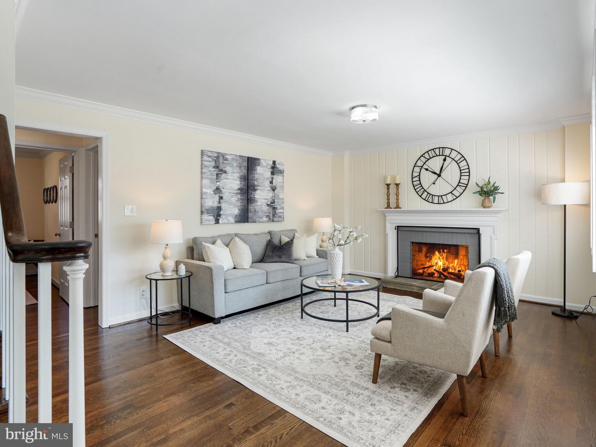 This fully renovated masterpiece in the sought-after Kent Gardens neighborhood sits on an unbeatable lot and features 5 spacious bedrooms, a fully finished lower level, refinished hardwoods, a welcoming en-suite primary bedroom with a sitting area, a primary bath with a double sink and quartz counters, an updated kitchen with quartz counters, stainless steel appliances, gas cooking and light shining throughout the home with large windows and multiple skylights. The main level also highlights an open and elegant living area with a wood-burning fireplace and a beautiful dining room. The huge lower level has both inside and outside access, perfect for guests and in-laws, with a large bedroom, an en-suite den with a full bath, a second laundry room, new carpet and a walk-out to the inviting stone patio. The expansive rear yard is a stunner, boasting a level, fenced-in, landscaped lot with mature trees. In the McLean High district and just steps to the many popular parks and recreation clubs in the area, this is truly McLean at its finest.