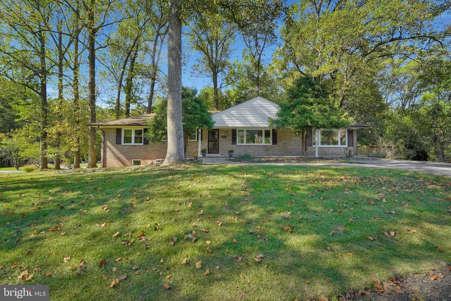 Sprawling, king-sized rambler on a private corner lot in Colesville Manor with a full, fully finished walkout lower level and upgrades throughout!  Oversized main level common area rooms provide loads of space for entertaining and daily living!  Huge living room with recently refinished hardwood floors, new energy efficient picture window, and brick hearth gas fireplace with glass doors opens to the formal dining room with refinished hardwoods and another new picture window! The spacious open kitchen has loads of Silestone quartz counter space and upgrades such as a door in door refrigerator with craft icemaker and a whisper quiet dishwasher.  Adjacent breakfast bar opens to the light-filled great room with radiant floor heating, a cathedral ceiling, built-in bookshelves, window seat, and two more new picture windows plus two exits to the freshly rebuilt wrap-around deck!  Three large main level bedrooms with two full baths including primary bedroom with private full bath with freshly re-tiled stand-up shower, while the shared main level bathroom has a marble counter and jetted Jacuzzi bathtub.  Great daylight lower level starts with two additional bedrooms(real BR'S) with more built-in bookshelves, with full hall bath, spacious family room with second glass-doored fireplace with a new oak mantle shelf, and rear exit to patio/yard.  The laundry room has been refinished including tile floor, custom molding and upgrades such as wifi-connected clothes washer & dryer, a second full refrigerator, and a 4-person red cedar sauna for relaxing after a hard day's work!  The lower level continues with a workshop area, finished under-stair nook, a bonus/game room and a large finished mudroom with a separate external entry door. Attached to the lower level, with a separate entry door, is the 300 sq ft storage shed with electricity and fluorescent lighting.  Large and level corner lot and great location near ICC and commuter routes to DC & Baltimore!  Extra-large home at a surprisingly affordable price!