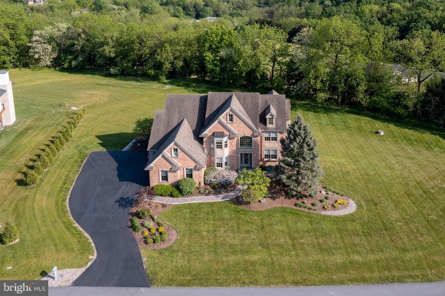 Welcome to a luxurious property that offers the ultimate in modern living. This stunning home boasts 6 bedrooms and 5 full baths, including one with a spa steam shower, perfect for unwinding after a long day. The recently finished lower level is an entertainer's dream, complete with a full bar kitchenette, family room, recreation room, and gym. With outdoor access and private access through the garage, this space could also work as an in-law suite. The high ceilings and large bedrooms create a sense of grandeur throughout the home. Four of the 6 BR's offer private bathroom access. Sitting on over an acre in a coveted community, this property offers breathtaking panoramic landscape views. Whether you're enjoying a morning cup of coffee on the patio or hosting a dinner party in the formal dining room, this home is sure to impress with it's endless customization. Come experience the epitome of luxury living at this magnificent property.