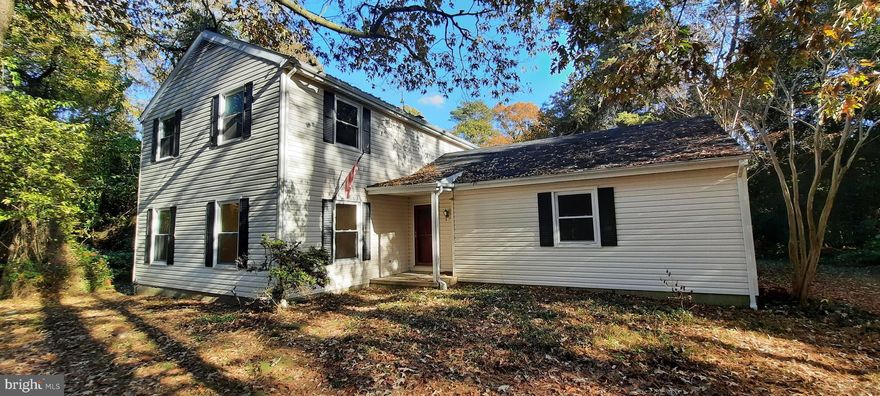 Welcome home to this spacious 3 bedroom 2.5 bath Colonial nestled on 2  private, partially wooded acres. Located in the peaceful park-like setting of Gilpin Point, a water-oriented and water-access community on the Choptank River. Bring your creative updating ideas and make this home your own!  The large family room has rustic hardwood flooring, a wood-burning stove, and a screen porch. The primary bedroom has a private bath and 2 closets. Other features include a separate living & dining room, a full basement, and an attached 2-car garage. Garage entry into the utility/laundry room.  Walk to Gilpin Park and enjoy the scenic views!  Just 1 short mile to Ganey's Wharf Boat Ramp Park, bring your boat and enjoy all the Choptank River has to offer! Just a 20-minute drive to Easton, close to shopping, dining, and much more.  Don't miss out on this opportunity, schedule an appointment today!