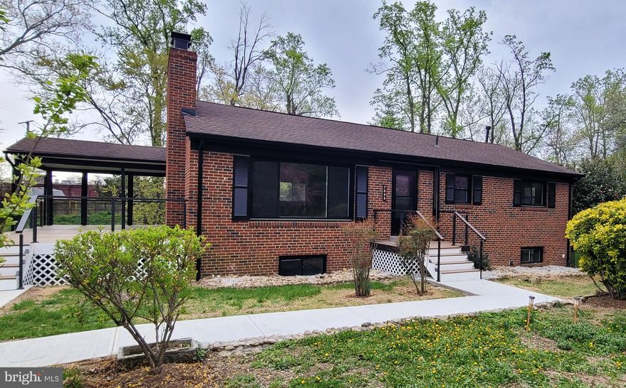 EXTERIOR YARD PICS TO BE UPLOADED***Truly a Must See!!! This Beautifully Renovated All Brick Single Family home has been Renovated Inside and Out on over a third of an acre!!**6 Bedrooms and 3 Full Baths set in an Open Floor plan with Custom Design throughout all levels**Front door leads you into an open living room, with a wood insert fireplace, surrounded by a custom wall of wood and invisible Led lighting that gives you that Special glow when turned on**Gourmet Kitchen with Waterfall High End Quartz Island and Countertops with the Waterfall Quartz cascading down the sides of the Solid Wood Cabinets, Stainless Steel Appliances, Custom door trim, and Crystal Pendant lights, that can dim from a low soft light, to high and bright LED***Matching Dining room lighting can also be controlled by the wall outlet, and remote**Walk out kitchen door to a Massive Custom Deck with Coverage to entertain in any weather**Custom Invisible LED lighting leads down the Hallway to the Master Bedroom with a Full Bathroom, 2 additional Bedrooms and a Hall Bathroom**Private Stairway leads up to attic, with flooring for extra storage**Follow the Staircase to the Lower Level with Custom LED lighting and Modern Design leading you to a very Spacious Recreation Room with a Beautiful view of the Rear Yard, 3 Bedrooms, a Laundry Room, Exquisite Full Bath with dual entry, and walks out to the rear yard with a covered top and sided door entrance**Custom upgrades throughout: 42 inch solid wood kitchen cabinets, high end quartz counters with waterfall effects, kitchen island with custom wood and LED invisible lighting to match the fireplace, Custom knobs and handles to match the kitchen touch faucet**GFCI outlet in kitchen with USB and Cell phone charging**ALL lighting in the house is controlled by light switches or remotes, dimming from soft light to high LED brightness**All three full bathrooms designed with high polished porcelain tiling, LED mirrors with anti-fog, new efficient toilets with self closing lids, custom faucets and knobs, light fixtures, glass doors and porcelain flooring**All new windows, Hot Water heater**Exterior features a HUGE deck made of Trex deck flooring, custom wire railings with two-thirds of the deck covered for entertaining in all weather, and one third to soak in the sunshine, with lighting on both corners of the steps, matching front door entrance with a modern LED lighting flare that also dims from soft light to high LED brightness. Paved driveway can hold at least 4 cars, and is surrounded by beautiful flowered bushes and trees, a cozy rear yard with a 240 square foot shed equipped with electricity and lighting. Prime location just minutes from Springfield Town Center, shopping, schools, commuter lots, major commuting roads, Springfield Metro and Fairfax County Parkway