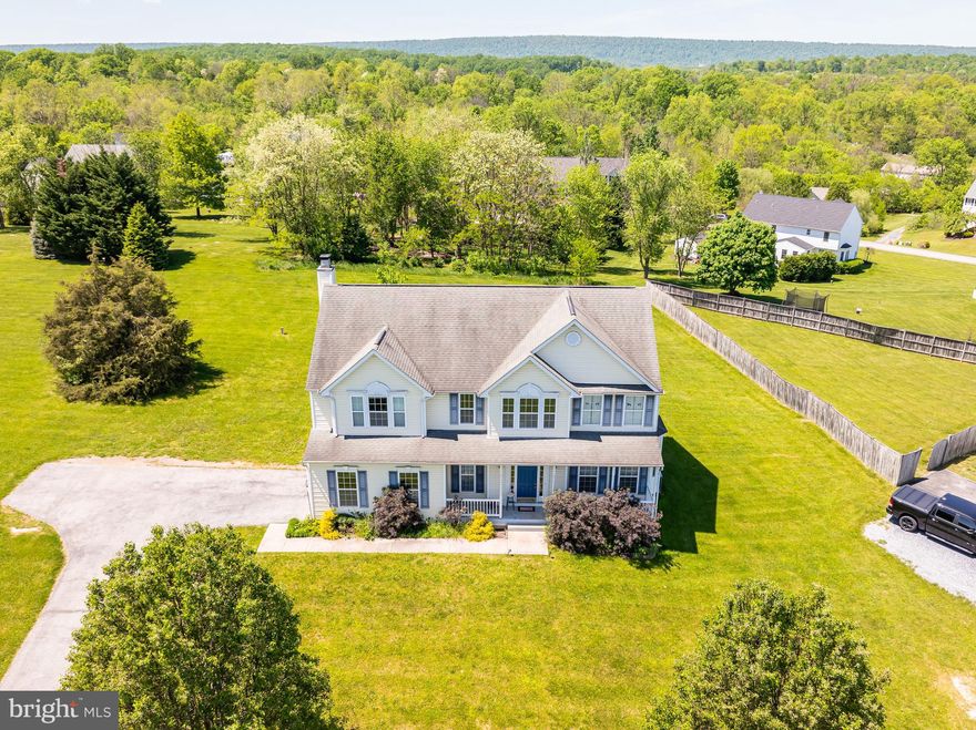 Spacious 4 bedroom, 2.5 bath Colonial on over an acre in South Berkeley County. Features include a spacious kitchen with island and breakfast room, family room with fireplace, separate living and dining room, 2 story foyer with hardwood floors, full unfinished walk-out basement with rough in for another bath, laundry on both the bedroom level and in the basement, mudroom with sink (great for pets), 2-car garage, wood deck and more!
The location in Bunker hill is an easy commute to Winchester, VA, and DC areas.
