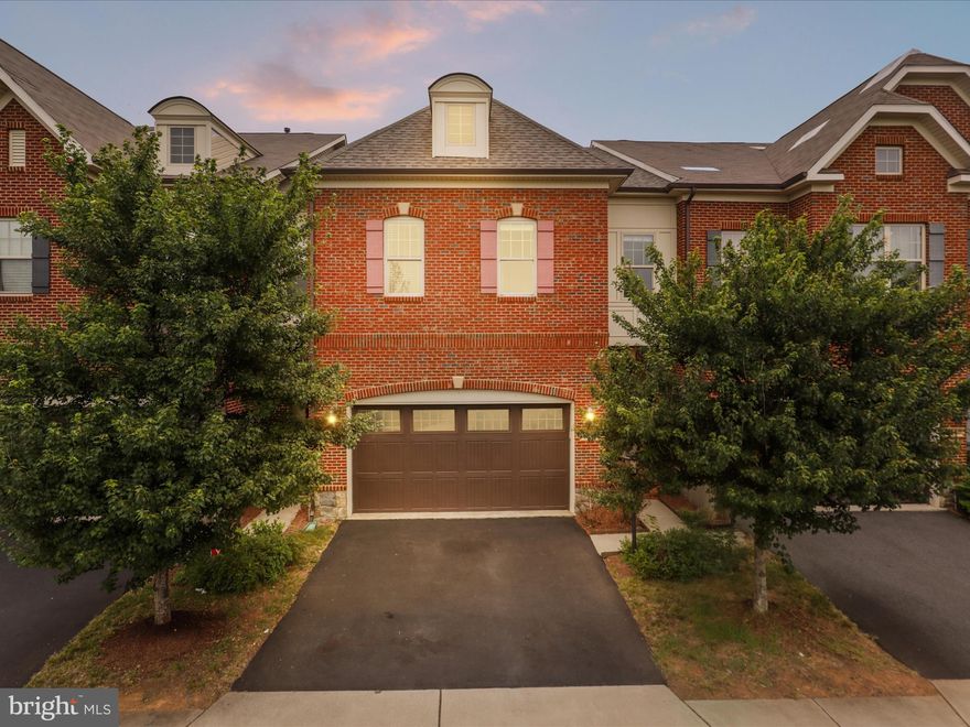 Elegant 3BR/3.5BA Carriage-Style Townhome with 2-Car Garage and 4,000+ SF of Finished Living Space in Brambleton***

Welcome to this beautifully appointed carriage-style townhome nestled in the heart of the highly desirable Brambleton community. Boasting timeless sophistication and modern comfort, this residence features a sought-after open floor plan designed for both luxurious living and effortless entertaining.***

The gourmet kitchen is a chef’s dream, adorned with gleaming granite countertops, a stylish subway tile backsplash, and premium stainless steel appliances. Rich hardwood floors grace the main level, complemented by soaring 10-foot ceilings that create an airy and inviting ambiance.***

Retreat to the expansive owner's suite, complete with a serene sitting area, two oversized walk-in closets, and private access to a charming balcony—perfect for morning coffee or unwinding at sunset. The spa-inspired en-suite bath offers a tranquil escape, featuring a deep soaking tub, separate stall shower, and elegant finishes.**

Generously sized secondary bedrooms each offer walk-in closets, ensuring ample space and comfort for family or guests. The lower level presents a versatile recreation room and a full bath—ideal for a home office, media space, or guest quarters.***

Step outside to a cozy private patio, perfect for al fresco dining or intimate gatherings. Enjoy the convenience of close proximity to Brambleton's premier shopping, dining, and entertainment venues, including theaters and walking trails.***

This home truly offers a rare blend of elegance, comfort, and location—a must-see for the discerning buyer.