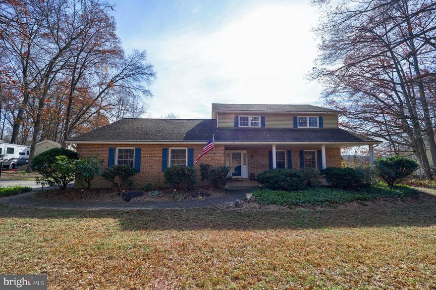 Traditional, solid home with 4 full bedrooms, 2.5 baths, and lots of hardwoods throughout. This home is ready for you to call your own and is on a beautiful semi-wooded lot in a great location. Just a few minutes from I-83 for those Maryland commuters and in a great school district. The family room has a wood burning fireplace and the oversized living room is great for entertaining your family and friends for holidays and celebrations There is the added attraction of the lovely sunroom with tile floors, vaulted ceilings, and electric heat for year round use. The basement is large for all your storage needs and there is a finished room that can be used as a 4th bedroom. The basement is dry and has a new radon fan installed in 2021. The lot is just shy of one acre and is partially wooded and includes an outbuilding with a wrap around deck for storage, yard equipment, big boy toys, etc.