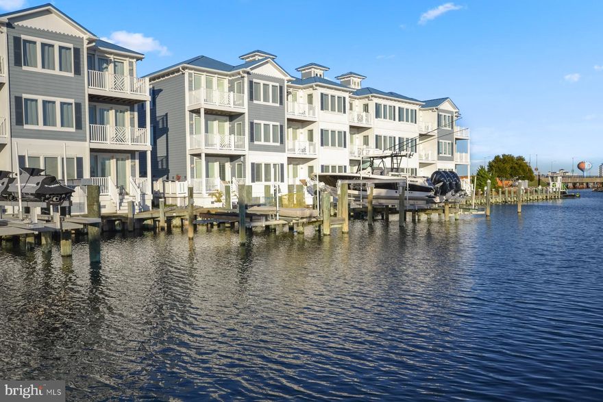 Welcome to your dream waterfront retreat at 13000 Marina View Lane #24, Ocean City, MD. This stunning townhouse, featuring 4 bedrooms and 4 full baths, is a masterpiece of coastal living. It has a  large deep water boatslip, it offers a perfect blend of elegance and luxury seaside living! 

Step inside to beautiful flooring leading you to the ultimate family room complete with water views & southern-exposure light flooding in. This level also features a full bathroom, dock/deck access, laundry room & garage access. 

Take the elevator up to an open layout that enhances the spacious feel of the main living area, where you can enjoy panoramic waterfront views from both sides of the home. The design is light and airy, with large soundproof windows and doors that bring the beauty of the outdoors in while maintaining tranquility inside. The gourmet kitchen is a chef's delight, allowing you to watch boats pass by as you prepare meals. 

The home also includes a large private deep water boat slip, making it easy to set sail to Assateague or explore the local waterways. A 2 car garage and an elevator add convenience to your lifestyle as well as a new HVAC system. The  glass shower doors have been upgraded throughout all bathrooms and elude elegance, adding to the spa-like feel. 

The community features a heated waterfront pool, perfect for relaxing while taking in the stunning views. This community also boasts low traffic without short-term rentals. Located near the bay near the inlet, you have quick access to all the local restaurants and attractions. 

This is more than a home; it’s a lifestyle. 

Don’t miss the opportunity to make this coastal paradise yours!