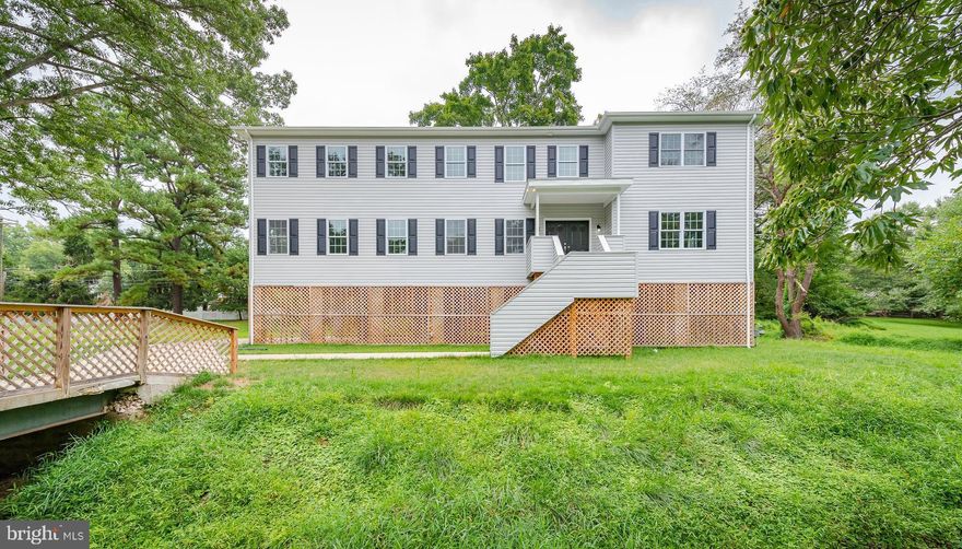 Contemporary home with open floor plan and like-new interiors is move-in ready! Rich hardwoods throughout, double tray ceiling in great room, dining room with bright bay window and access to the deck. Kitchen boasts sleek granite counters, tiered breakfast bar, stylish pendant lighting, and stove with downdraft, perfect for entertaining! Main level ensuite bathroom, additional bedrooms are generously sized.  Master bedroom with tray ceiling and bathroom with glass enclosed frameless shower, corner tub, and double vanity. Welcome home!