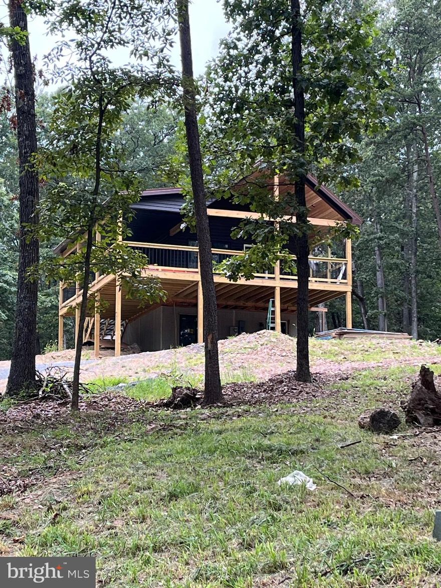 Nestled on nearly 3 acres of serene, wooded beauty in southern Morgan County, this brand new 3-bedroom, 2-bath home offers the perfect blend of comfort and tranquility. Step out onto the expansive, oversized Trex deck featuring a stunning cedar tongue-and-groove ceiling with a fixed outdoor fan, perfect for relaxing while overlooking your private pond. Inside, you’ll find a gorgeous kitchen with quartz countertops and custom cabinetry, seamlessly continued throughout the bathrooms. The master suite boasts a luxurious stone shower, adding a spa-like touch to your everyday routine. Located in a peaceful community with two stocked ponds for fishing, this property offers privacy, abundant wildlife including deer, and a quiet, natural setting that’s hard to find elsewhere. Beautiful, private, and serene, this home is ready to welcome you to country living at its finest.