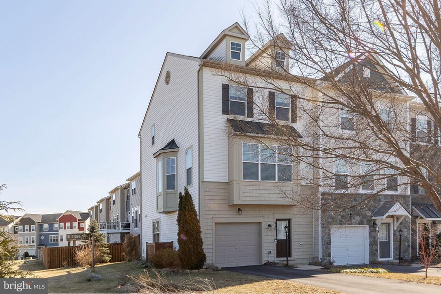 This stunning end-unit townhome is situated in an elite neighborhood, offering both privacy and access to top-tier community amenities. With 3 spacious bedrooms and 2 full baths, and 2 half baths, this home is perfect for anyone seeking modern comfort and convenience. The open floor plan seamlessly connects the living, dining, and kitchen areas, making it ideal for both relaxation and entertaining.
The living room features large windows that flood the space with natural light, creating a bright and welcoming atmosphere. The kitchen is equipped with high-end appliances, sleek countertops, and a spacious island that provides additional seating. Step outside onto the composite deck, where you can enjoy beautiful views and entertain guests or relax with a cup of coffee. The private patio below offers additional outdoor space, ideal for gardening or creating a cozy retreat. Primary bedroom is generously sized, with an en suite bathroom offering a luxurious touch, including a walk-in shower and double vanity. The additional bedrooms are spacious and share a well-appointed bathroom, making this home practical and located near an elementary school,. The neighborhood also offers a variety of benefits, including community pool,  walking trails, and a clubhouse, all just steps away from your front door.