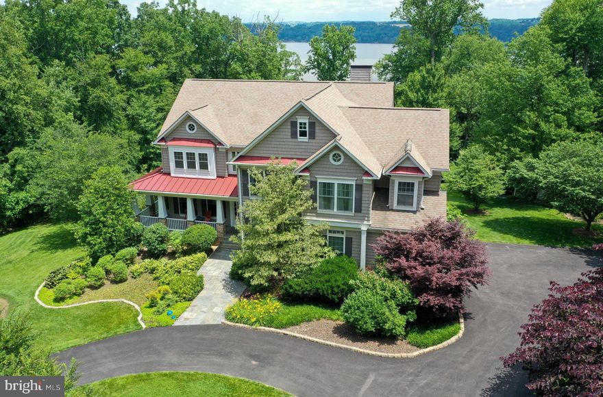 Absolutely stunning waterfront views are yours in this private estate on nearly 5 lush, acres in a gated community. Perched above the Susquehanna and offering unrivaled privacy, security and a seclusion. Outdoor space and almost every room offers amazing views including show stopping views of Susquehanna River, mature trees and thriving wildlife!  The convenient circular drive offers distance from the private community and lightly traveled road. Luxurious yet practical living. Boasting 4+ Bedrooms plus 5 full baths featuring hardwood flooring, fabulous custom crown molding & chair rail. You are greeted by a grand foyer with a split staircase. Offering an incredible Gourmet Kitchen with oversized custom island, granite counters, top-of-the-line stainless appliances. The home offers a formal Living and Dining Rooms with fine detailed touches throughout. The great room offers vaulted ceilings, custom stonework, custom floor to ceiling windows, & cozy pellet stove. Featuring a large, custom library loaded with built-ins. The Master suite offers a sitting area & luxury Bath plus 3+ additional bedrooms. To punctuate the home the lower level offers a fully finished space with an office, exercise room with sauna & plenty of storage round out this superb package!  Bonus space offers a great workshop.