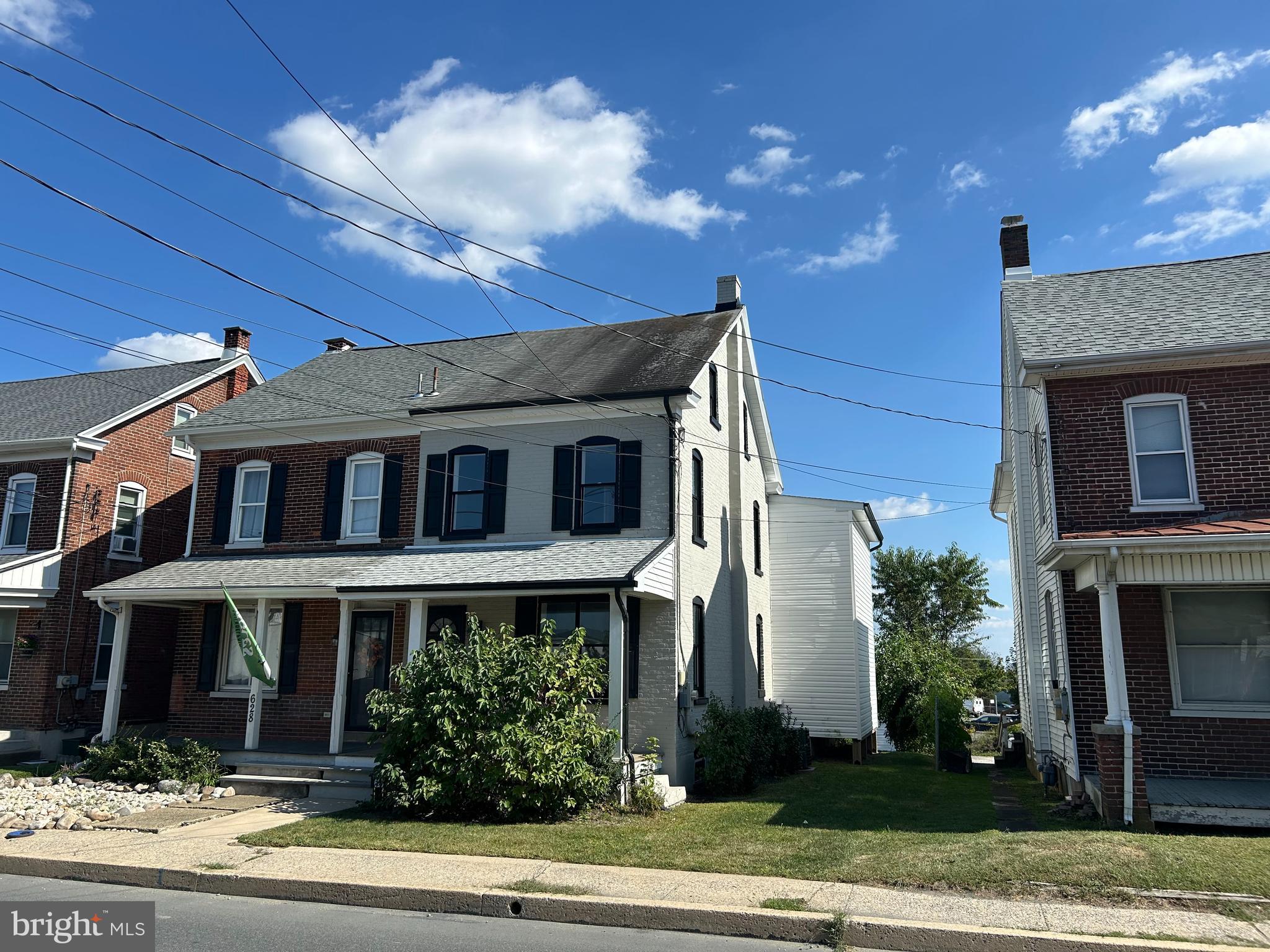 Welcome to this recently updated and modern twin home in the heart of Boyertown. Offering 3 bedrooms, 2.5 bathrooms, and a host of high-end finishes throughout, this property is a must-see. Step inside to discover a bright and spacious open-concept layout encompassing the living, dining, and kitchen areas. The first floor features luxury vinyl plank flooring, updated baseboards, doors, and window trim. The stylish kitchen is a standout, boasting solid wood, soft-close cabinetry, granite countertops, a marble tile backsplash, and newer stainless steel appliances, including a dishwasher and range/oven. Just off the kitchen, you'll find a versatile mudroom or casual dining area leading to the rear entrance, a convenient first-floor laundry room with additional storage space, and a private half bath. Upstairs, the expansive primary suite includes a walk-in closet with built-in organizers and a beautifully renovated ensuite bathroom featuring a double vanity and a tiled walk-in shower. A second full bathroom with a tub/shower combo and another spacious bedroom complete the second floor. The third level boasts a third bedroom or flex space perfect for a home office, guest room, or playroom. Throughout the home, you’ll find cohesive modern finishes such as brushed nickel and black hardware, updated vanities, fixtures, toilets, doors, designer tile and patterned carpet—every detail thoughtfully chosen and recently upgraded. One of the property’s standout features is the detached two-car garage, fully renovated with a newer roof, vinyl siding, windows, professionally epoxied floors, and a full stairway to a second level for added storage or workspace. A gravel driveway provides additional off-street parking. The basement offers ample storage, while major systems have been recently updated, including a newer HVAC system, hot water heater, updated plumbing, and electrical. Located in the Boyertown Area School District, this home is just a short walk to downtown Boyertown, home to the Colebrookdale Railroad, the Boyertown Museum of Historic Vehicles, charming shops, and local dining. Easy access to Route 100 makes commuting a breeze. Don’t miss the opportunity to own this turn-key, move-in-ready home. Schedule your private showing today!