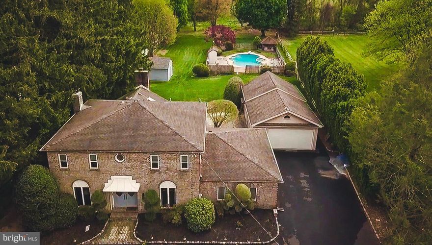 Welcome to this exceptional 4-bedroom, 2.5-bath home located in the highly sought-after Council Rock School District, offering comfort, space, and endless potential. From the moment you arrive, the circular driveway and expansive 4-car garage (2 attached, 2 detached) set the tone for both convenience and impressive curb appeal. The detached garage is further enhanced by a dedicated workshop area and an additional storage shed, making this property ideal for hobbyists, car enthusiasts, or those in need of extra space. Inside, the home unfolds with a warm and inviting layout designed for both everyday living and entertaining. The spacious eat-in kitchen serves as the heart of the home, featuring abundant cabinetry, a pantry for added storage, a stylish backsplash, stainless steel appliances, and enhanced countertop lighting. Sliding glass doors with remote-controlled curtains open seamlessly to the patio, blending indoor comfort with outdoor living. The inviting family room is filled with natural light from stunning skylights and features a cozy fireplace, ceiling fans, and direct access to the patio through sliding doors.  A built-in wet bar makes entertaining effortless, whether hosting movie nights, game days, or casual gatherings with friends and family.  Upstairs, the primary suite provides a private retreat with generous closet space and a spa-like bath featuring a jacuzzi tub, separate shower, bidet, and towel warmer. Additional bedrooms are well-sized and versatile, complemented by an updated full bath with a towel warmer.  A dedicated home office with decorative doors provides a quiet, private setting ideal for remote work or client meetings, ideally positioned just inside the main entrance for added convenience.  A conveniently located first-floor powder room is situated off the laundry area. The walk-out basement expands the home’s versatility, offering endless possibilities as a fitness area, playroom, workspace, additional food prep area, or extended storage—tailored to fit your lifestyle needs. Step outside and discover your own private oasis. The generously sized patio is partially covered and thoughtfully designed with a skylight and ceiling fan, providing a comfortable outdoor retreat even on warmer days. Whether hosting gatherings or enjoying quiet moments, the space is perfectly suited for relaxation. Complete the experience by lounging poolside or unwinding in the jacuzzi, creating a true resort-like atmosphere right at home.
A place to live beautifully, entertain effortlessly, and feel completely at home. Come see this home in person to truly experience everything it has to offer.