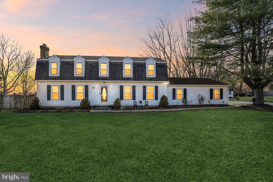 Nestled in the serene community of Nokesville, this exquisite Colonial-style residence offers a harmonious blend of comfort and sophistication. Spanning over 2,300 square feet, this home is designed for those who appreciate both elegance and functionality. Step inside to discover a thoughtfully laid-out traditional floor plan that invites warmth and connection. The heart of the home features a spacious dining area, perfect for hosting intimate gatherings or festive celebrations. The kitchen is a culinary enthusiast's dream, boasting an island that provides ample prep space and a cozy table area for casual meals. Equipped with high-end appliances, including a sleek electric oven/range, dishwasher, and refrigerator, this kitchen is as practical as it is stylish. Natural light pours in through double-pane windows adorned with tasteful treatments, creating an inviting atmosphere throughout. The living area is anchored by a stunning fireplace with glass doors, offering a perfect spot to unwind on chilly evenings. Retreat to the primary bath, where relaxation meets luxury, providing a serene escape after a long day. The home's interior is in very good condition, ensuring a move-in ready experience for its new owners. Outside, the property is set on a generous 1.04-acre lot, providing ample space for outdoor activities and gardening. The exterior features charming vinyl siding and well-maintained sidewalks that enhance the curb appeal. A spacious deck extends from the home, ideal for al fresco dining or simply enjoying the tranquil views of the surrounding pasture. For those with hobbies or storage needs, a convenient shed is included, offering additional space for tools or outdoor equipment. The attached side-entry garage accommodates two vehicles, ensuring easy access and security. This residence not only offers a beautiful home but also an exclusive lifestyle, surrounded by nature and tranquility. With no pool to maintain, you can spend your weekends exploring the picturesque landscape or enjoying the peaceful ambiance of your new sanctuary. Experience the perfect blend of luxury and comfort in this remarkable property, where every detail has been curated for an elevated living experience.