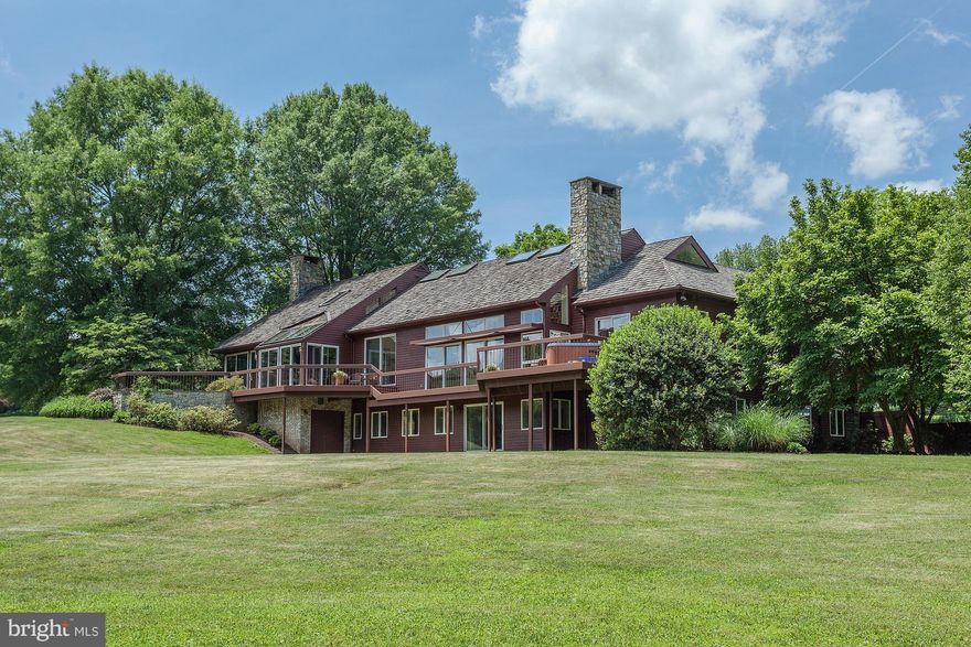 With a spectacular setting sprawling over 7+ gated acres, this residence is truly a one-of-a kind offering. Light-filled home on three levels with a 2-story foyer, gourmet kitchen opening to large family room with cathedral ceilings, main level master suite & walkout lower level. Grounds offer pool w/ spa, tennis court, pond frontage, deck with hot up & circular driveway.