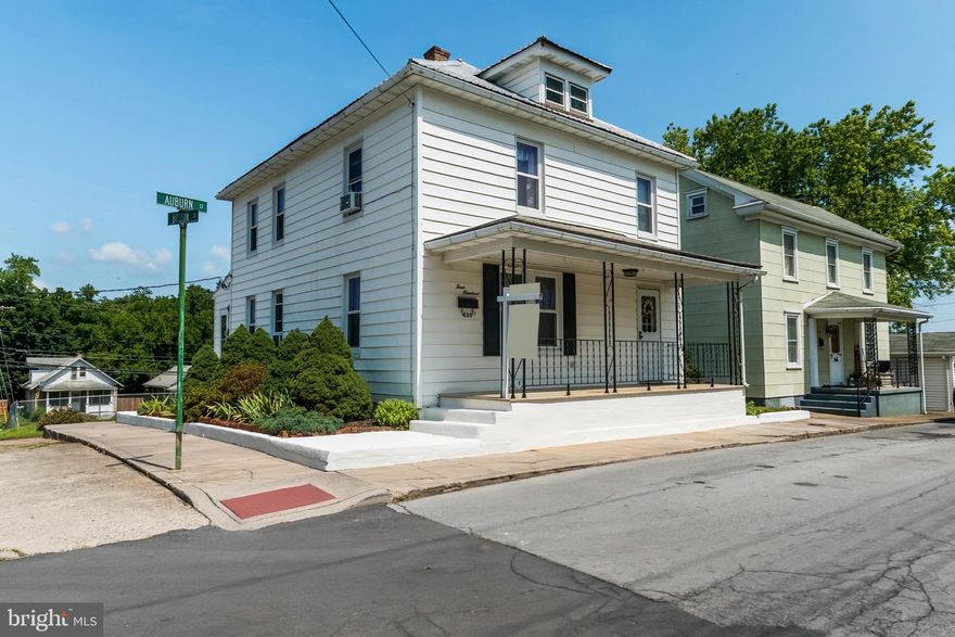 Multiple offers received. Best and final offers are due by Wednesday, July 12 at noon EST. Presenting a captivating home with timeless charm, this enchanting residence was built in 1900 and exudes character and elegance. Nestled on a corner lot, this well-maintained property offers a delightful living experience, ideal for those seeking comfort and tranquility. As you approach, you'll be greeted by a welcoming covered front porch, providing a serene space to unwind and savor the surrounding natural beauty.  Step inside this captivating home to discover three generously-sized bedrooms and two baths, including a thoughtfully designed handicapped-accessible bath on the main level. This meticulous layout ensures convenience and accessibility for all occupants, accommodating diverse needs.  The property boasts replacement windows that not only enhance energy efficiency but also create a peaceful ambiance by reducing external noise. Furthermore, the electric system has been thoughtfully updated, guaranteeing safety and reliability for years to come.  Underneath the carpeted areas, you'll uncover the timeless allure of hardwood flooring, waiting to be revealed and admired. This enchanting feature adds a touch of sophistication and serves as a canvas for personalization, allowing you to infuse your unique style into the interior design.Convenience is paramount in this remarkable home, with the added advantage of a main-level laundry area housing both a washer and dryer. This clever placement ensures effortless completion of daily tasks, making laundry a breeze. Moreover, the home is equipped with a newer washer and hot water heater, providing peace of mind and efficient functionality.  With its captivating blend of historic charm and modern upgrades, this well-maintained residence represents an exceptional opportunity for buyers in search of a comfortable and accessible home. Don't miss out on this remarkable gem, where classic elegance harmonizes with contemporary conveniences.