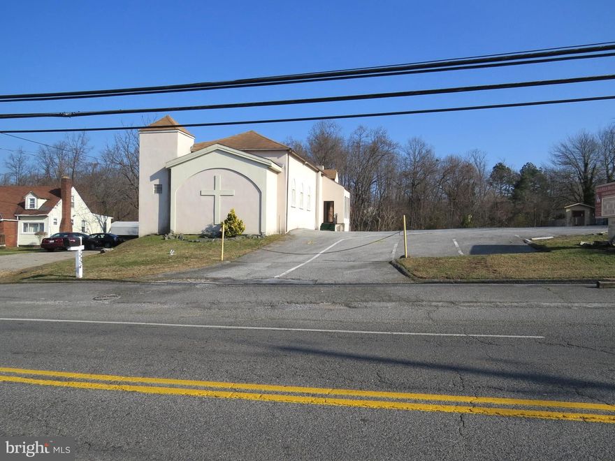 $100,000 credit provided at full price offer.! This edifice has a beautiful sanctuary along with other great spaces which includes a moderate fellowship hall, pastor's study, multiple class rooms,  multiple lounge areas (1 with a fire place), kitchenette ,  along with 2 restrooms on the main level and an additional restroom on the 2nd level.  This property also has a cellar basement for storage that's accessible  only from the exterior.  It provides more than enough generous parking.  It also has visible signage in the front of the building.  Sold as is.